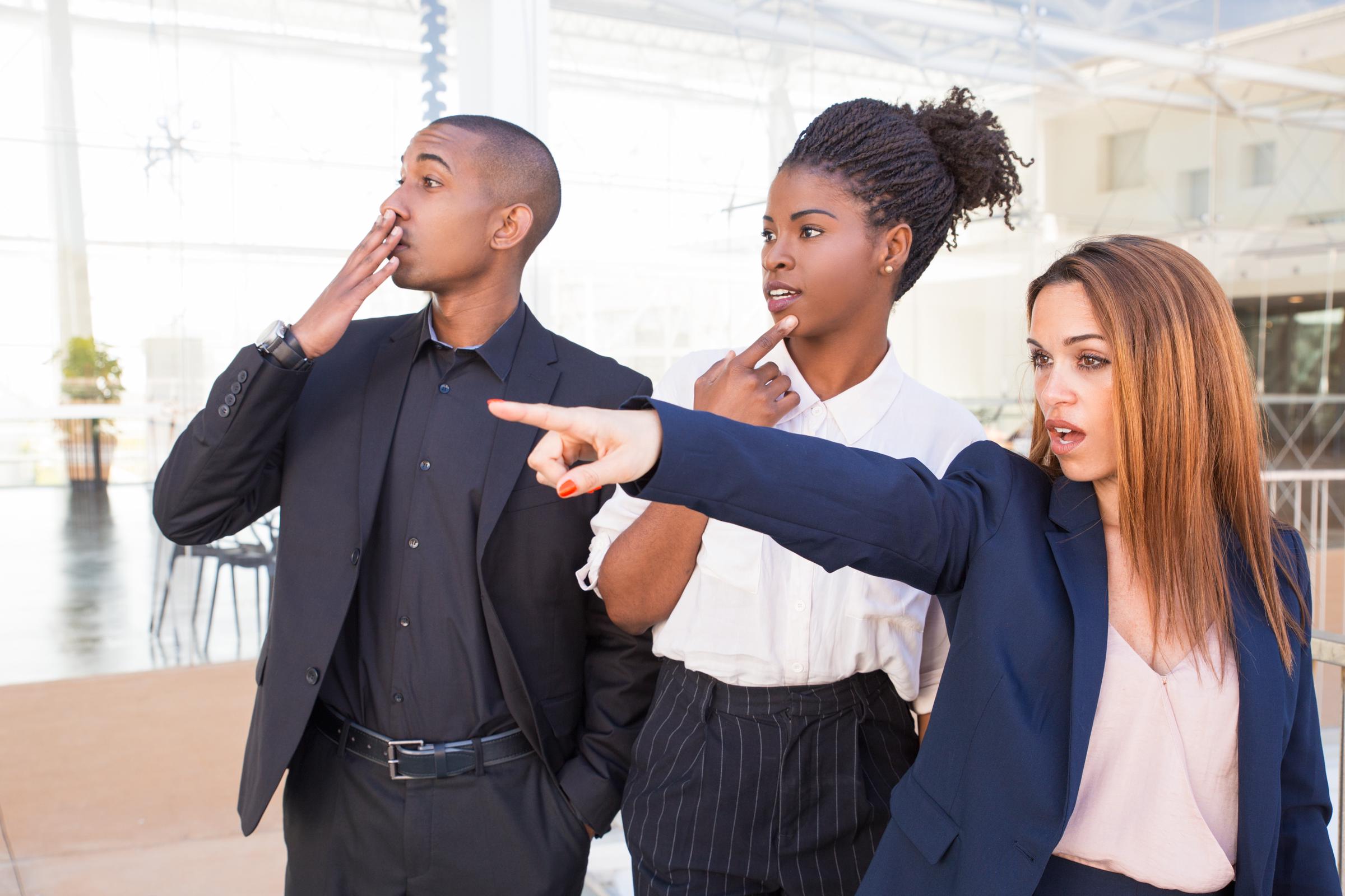 Confused and shocked people staring and pointing at an event | Source: Freepik