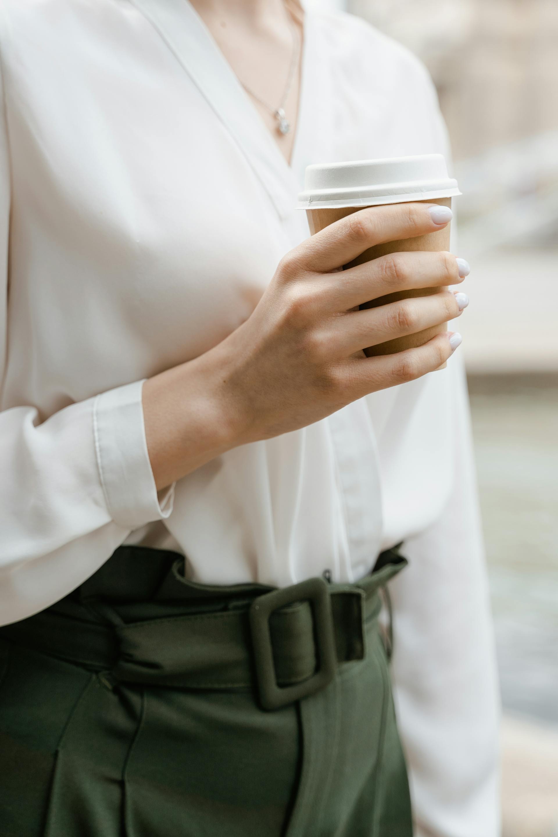A close-up shot of a woman holding coffee | Source: Pexels