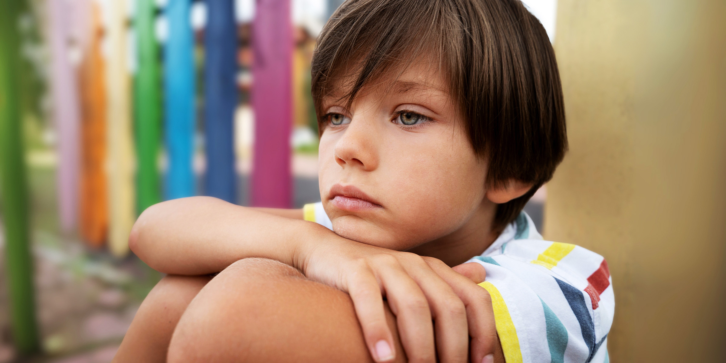 A sad little boy sitting alone | Source: Freepik