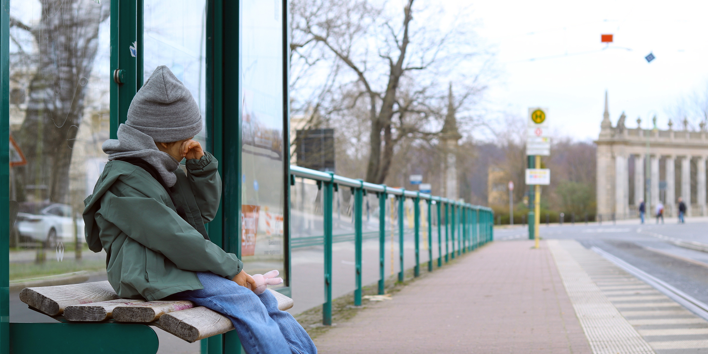 Abandoned kid at the bus stop | Source: Shutterstock