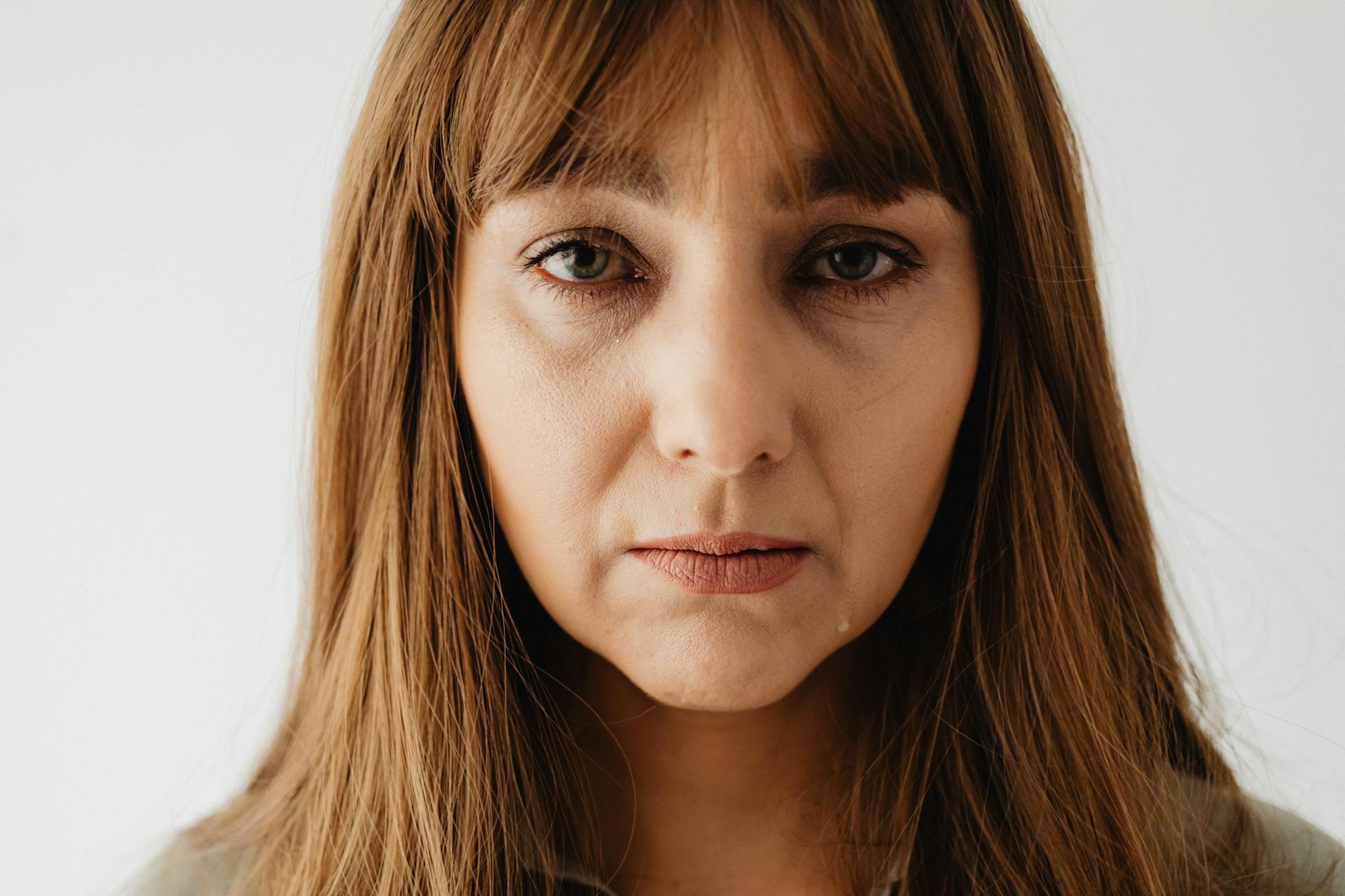 Close-up shot of a teary-eyed woman | Source: Pexels