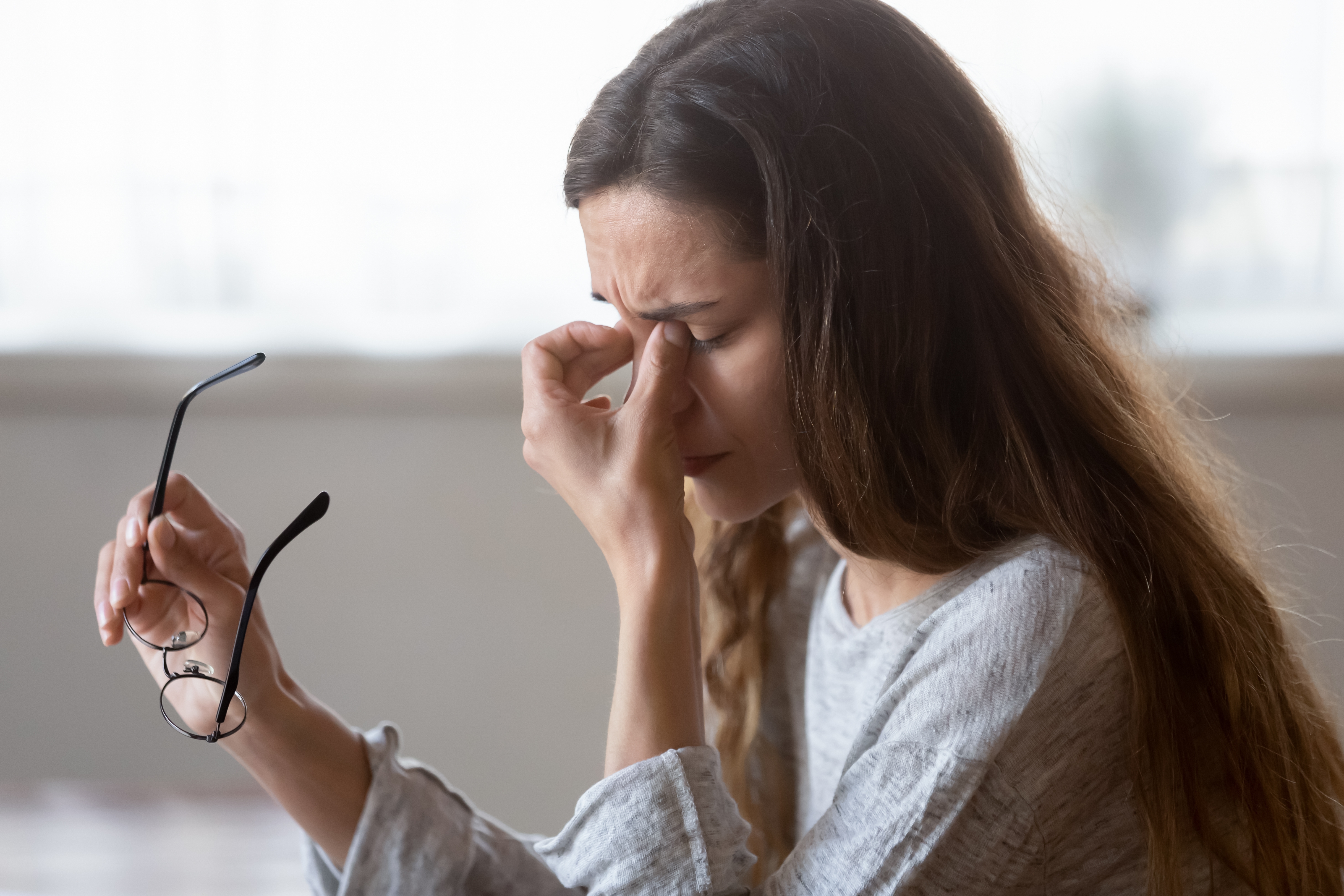 A young woman feeling sad | Source: Shutterstock