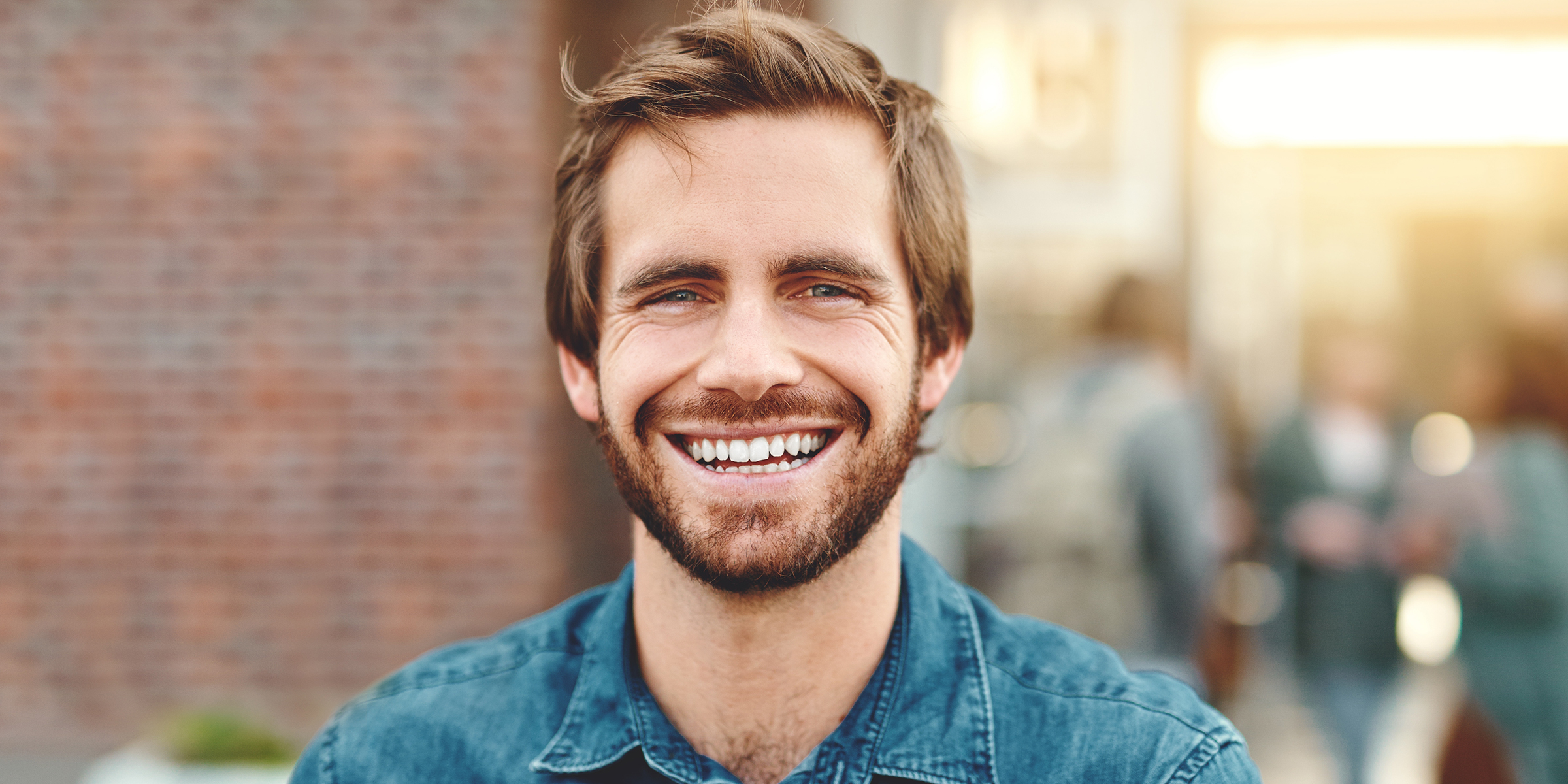 A young man smiling | Source: Shutterstock