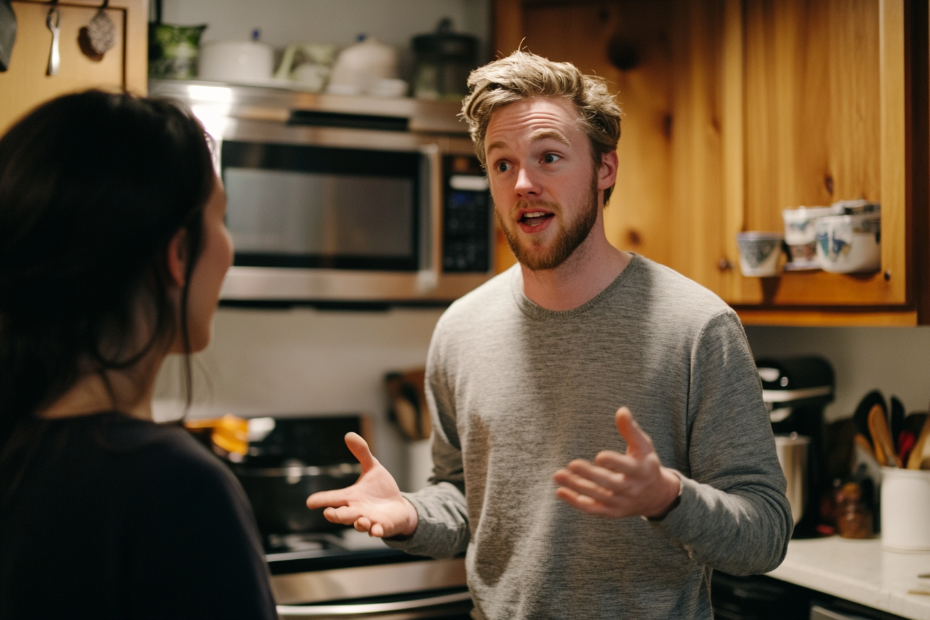 A man speaking to a woman in a kitchen | Source: Midjourney