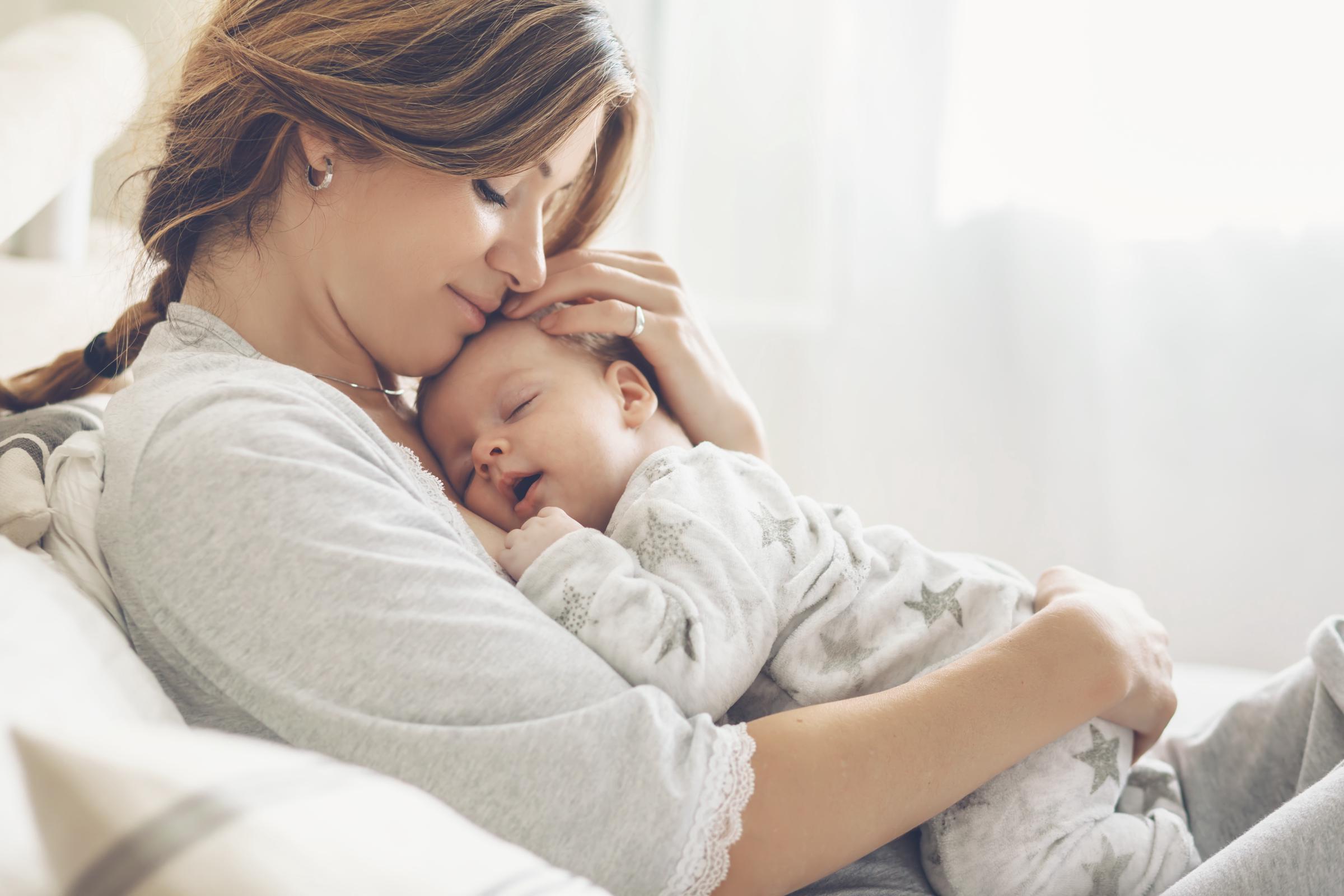 A mother with a newborn | Source: Shutterstock