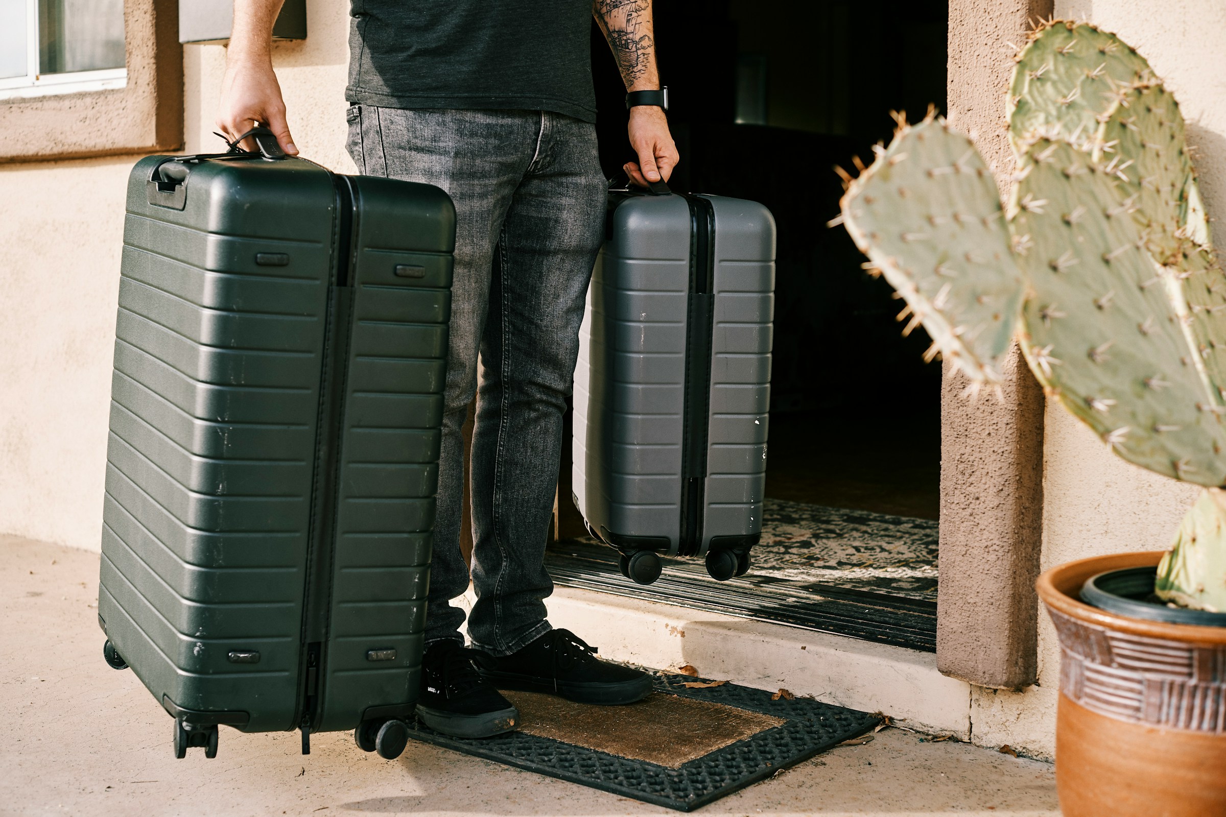 A man carrying suitcases | Source: Unsplash