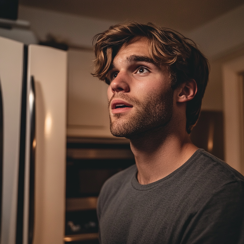 A man looks confused while standing in the kitchen | Source: Midjourney