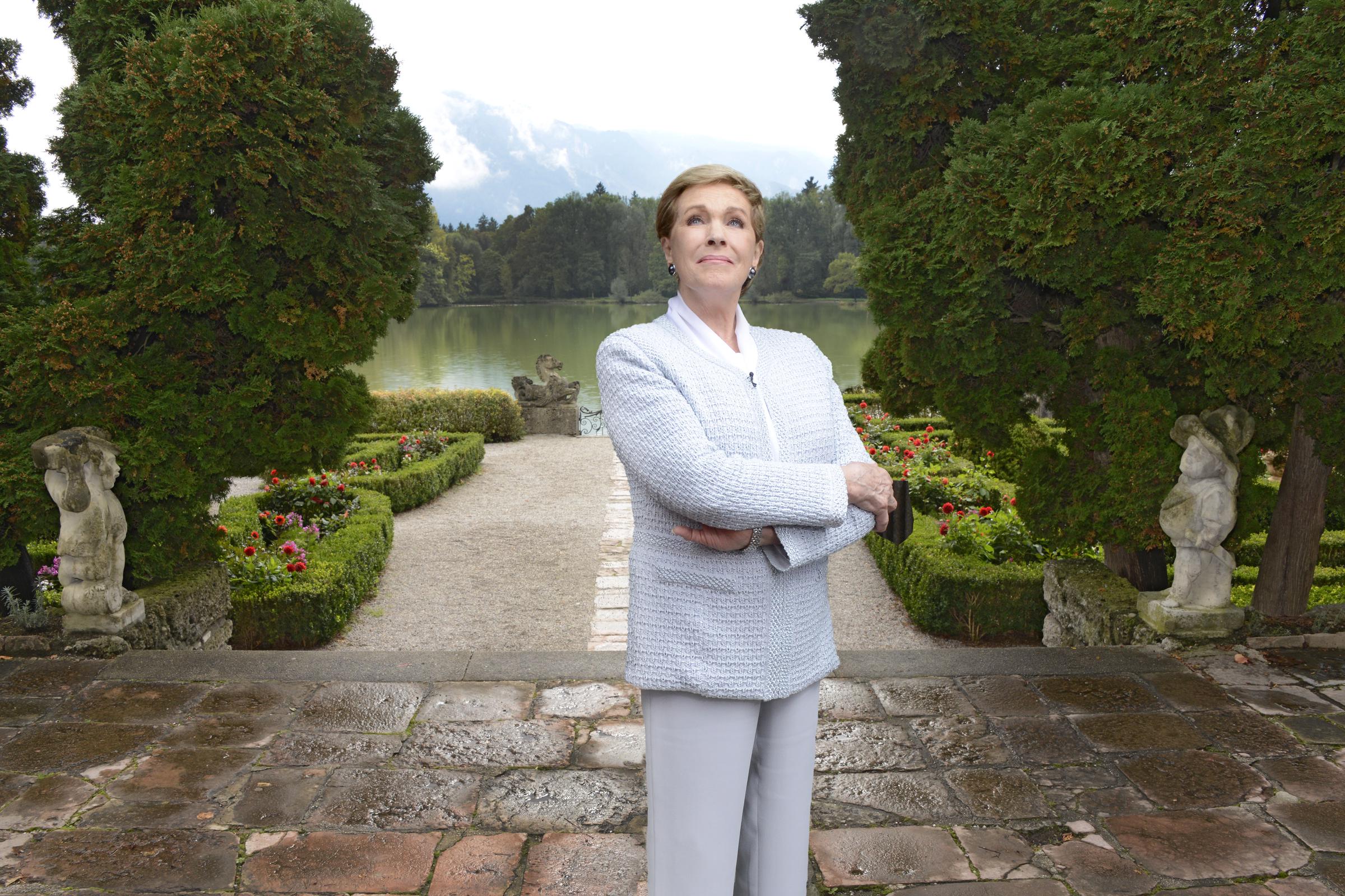 Julie Andrews revisiting the lakeside terrace at Schloss Leopoldskron in Salzburg, Austria, one of the locations for the film, "The Sound of Music" where she portrayed lead character Maria, September 2014 | Source: Getty Images