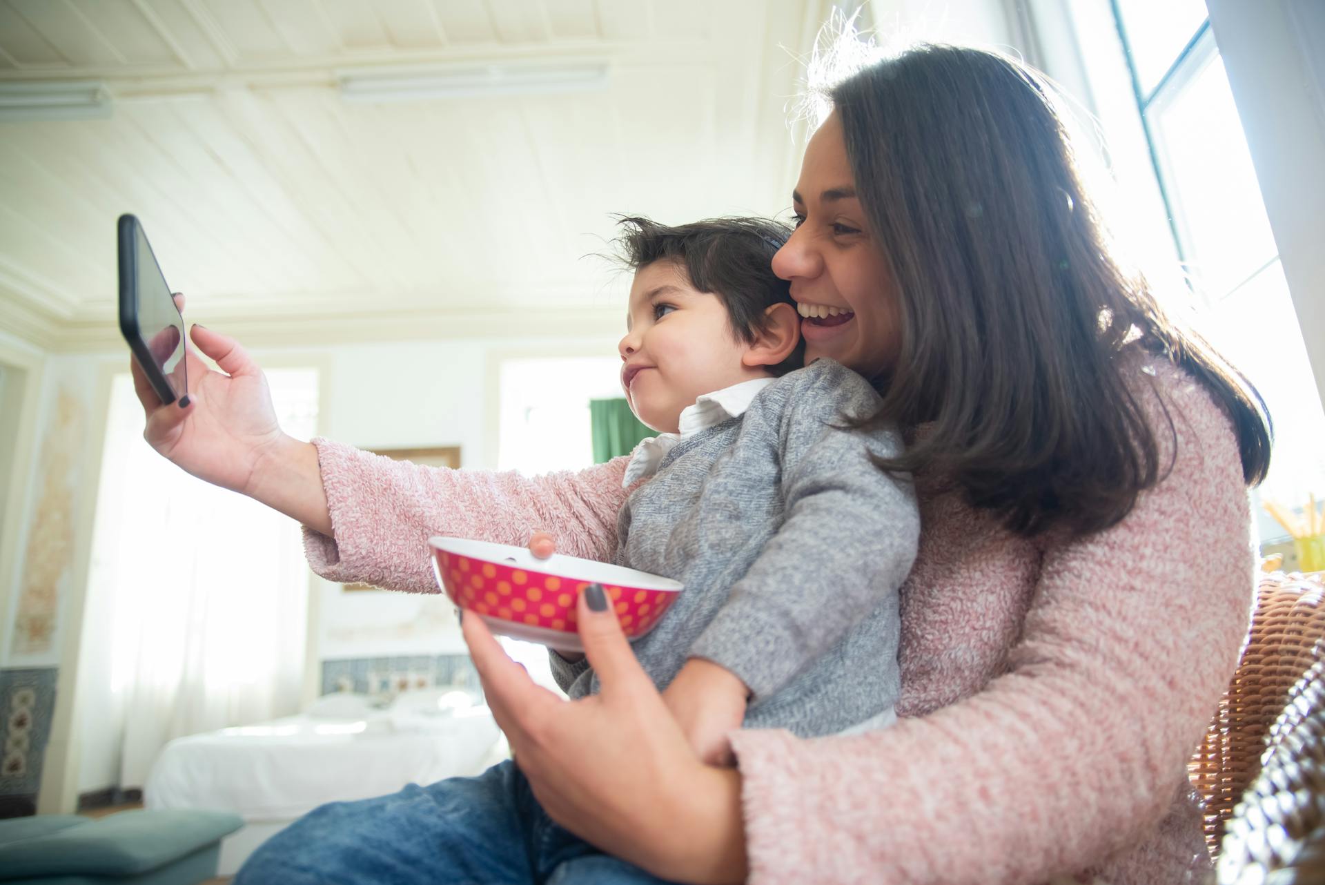 A woman playing with her son | Source: Pexels