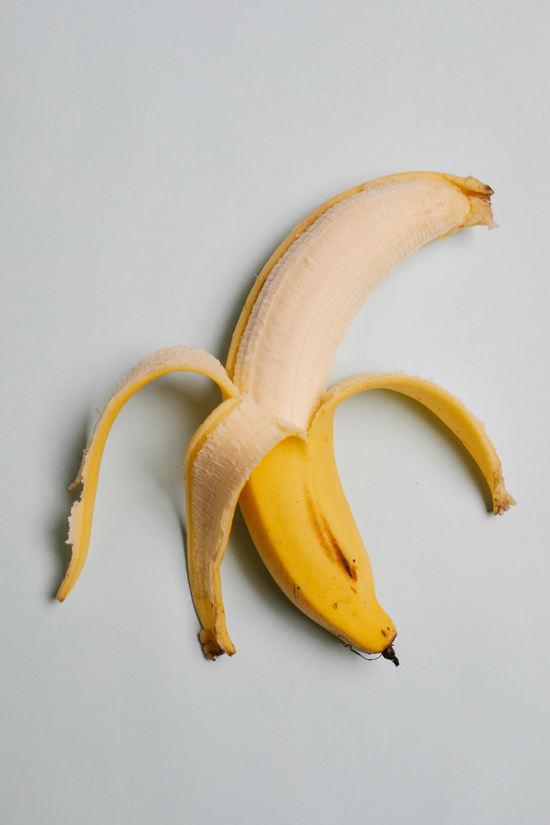 A partially peeled banana | Source: Pexels