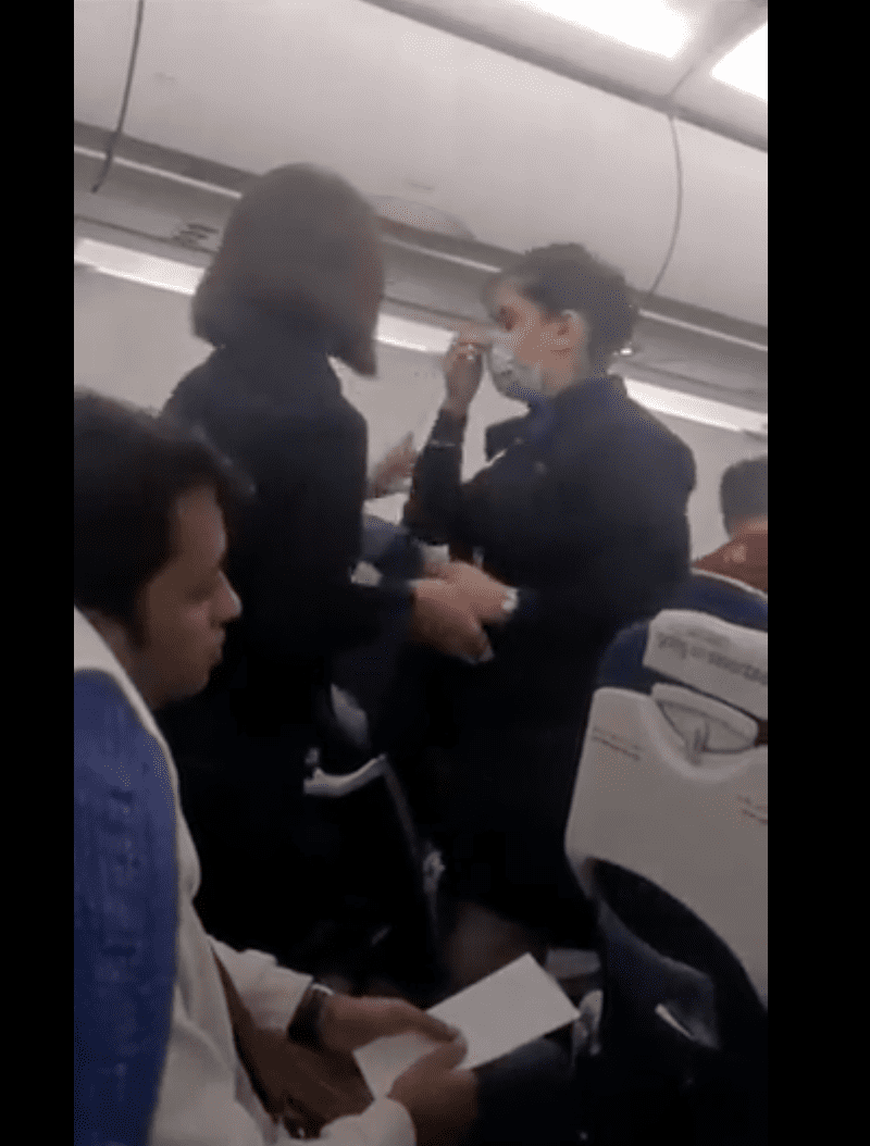 The female flight attendant from IndiGo airline, alongside her colleague. | Source: Twitter.com/shukla_tarun