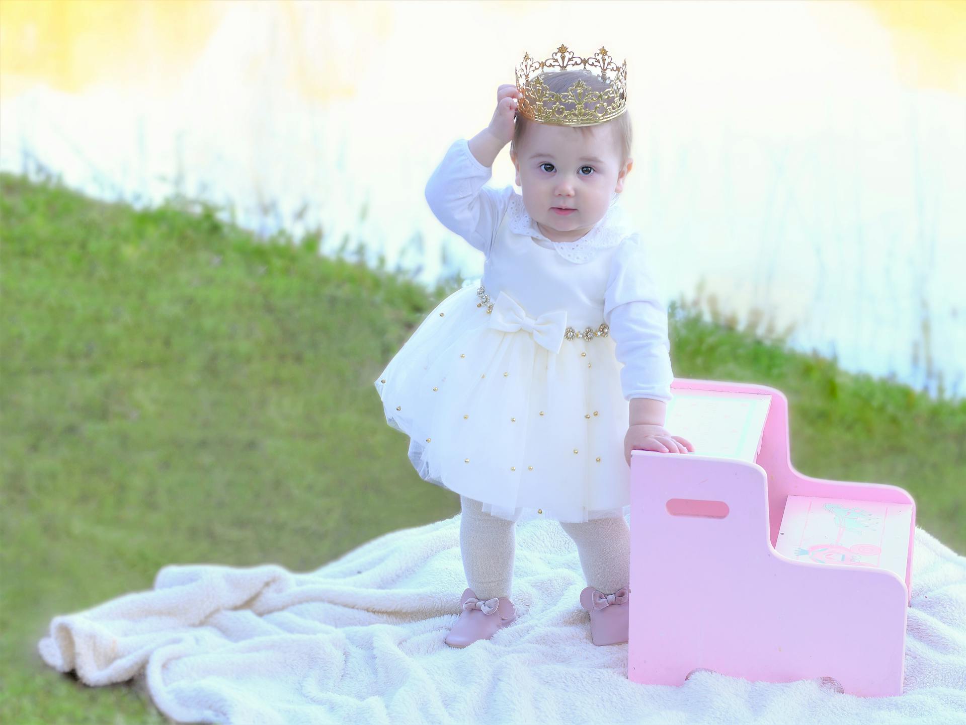 A cute baby girl dressed like a princess | Source: Pexels