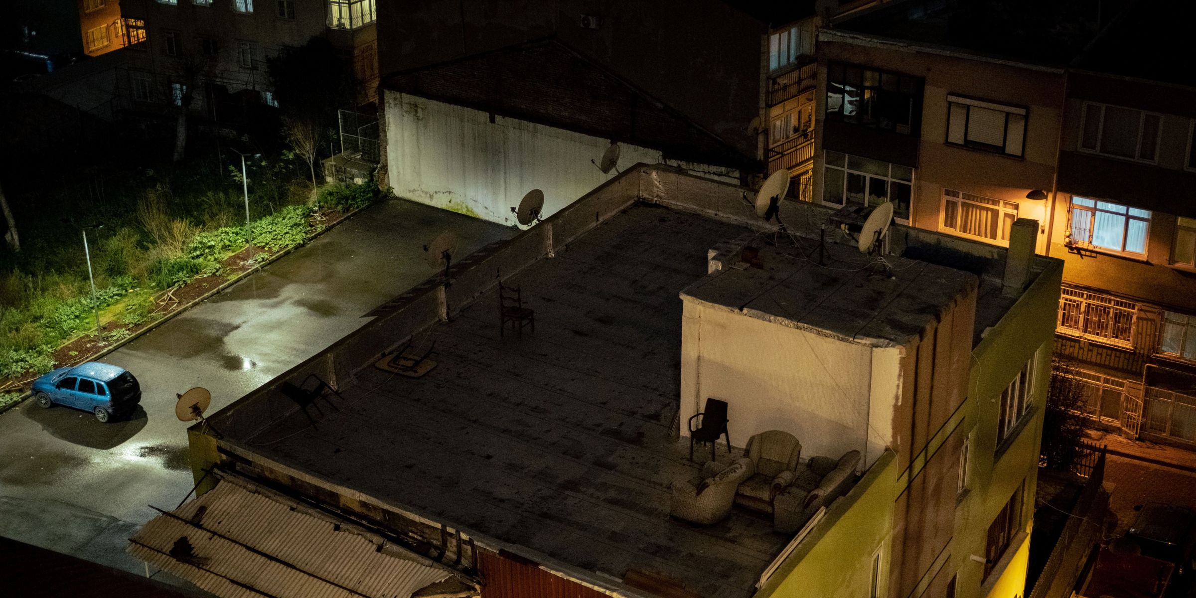 A rooftop at night with chairs | Source: Pexels