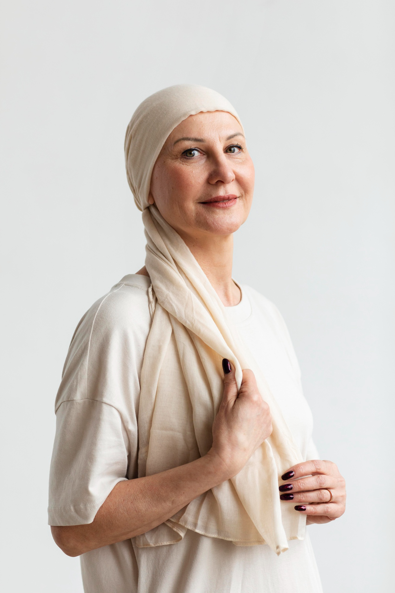 A middle-aged woman with a scarf around her head | Source: Freepik