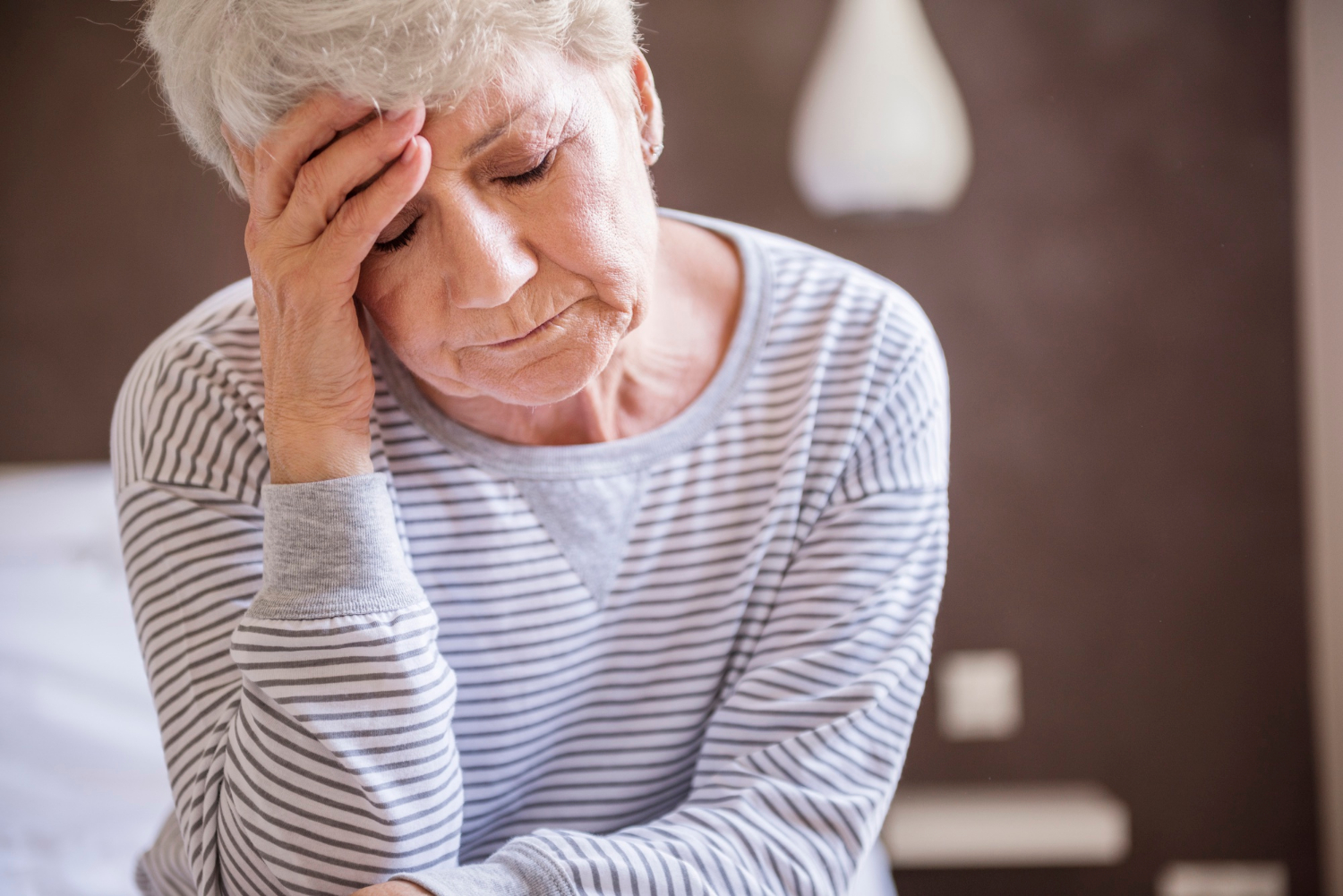 A depressed elder woman | Source: Freepik