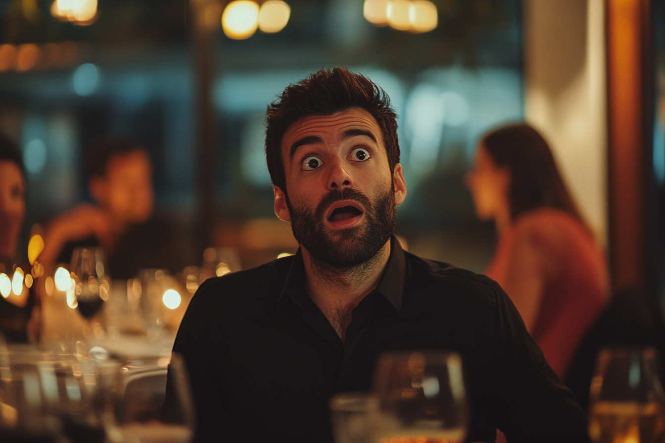 A surprised man at a restaurant looking up | Source: Midjourney