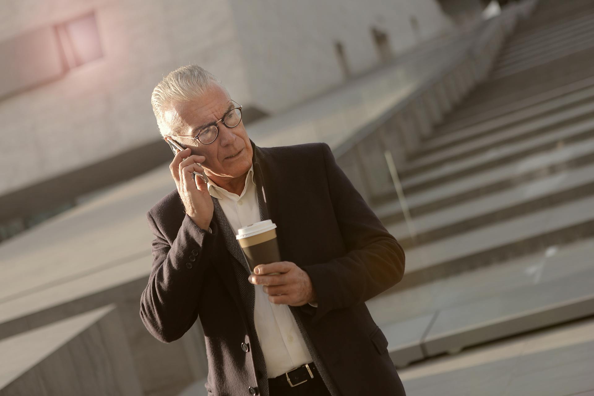 A stunned older man talking on the phone | Source: Pexels