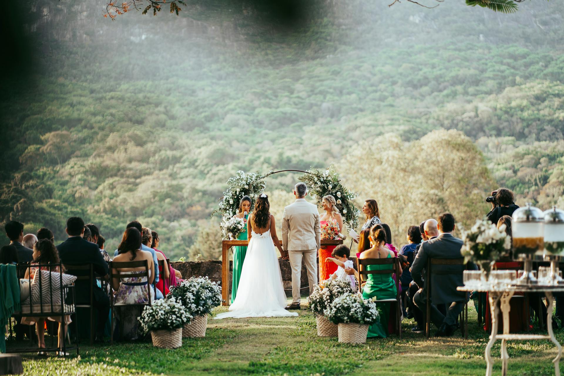 A beautiful outdoor wedding ceremony with a bride and groom standing at the altar | Source: Pexels