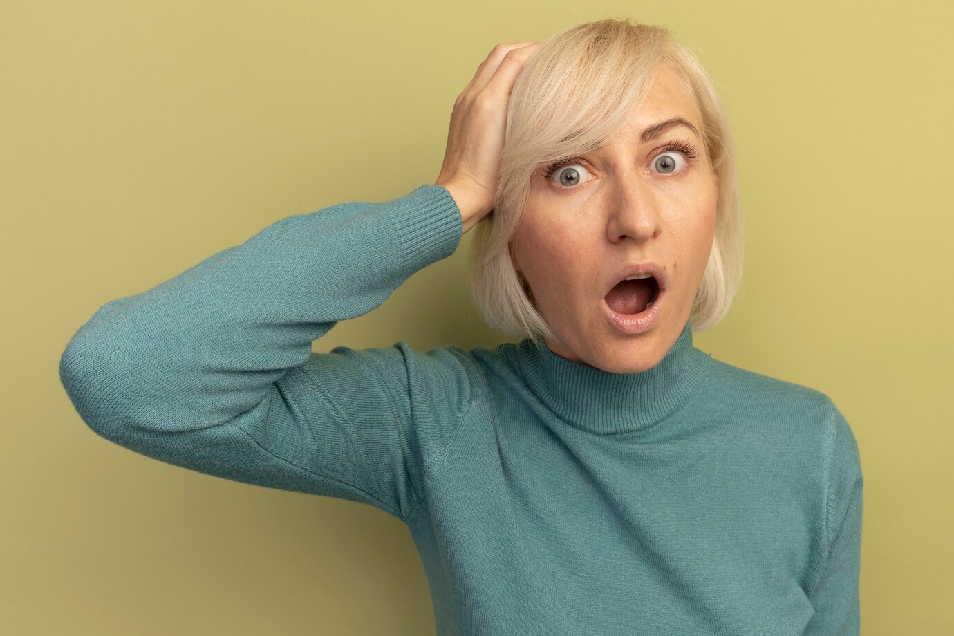 A shocked middle-aged woman | Source: Freepik