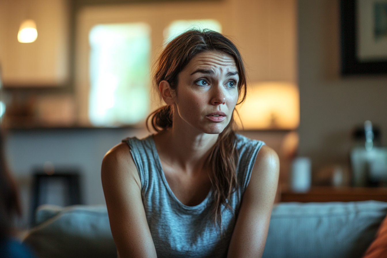 A woman on a sofa looking doubtful | Source: Midjourney