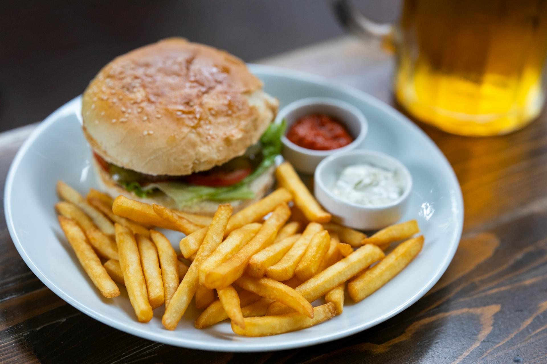 A burger and fries on a table | Source: Pexels