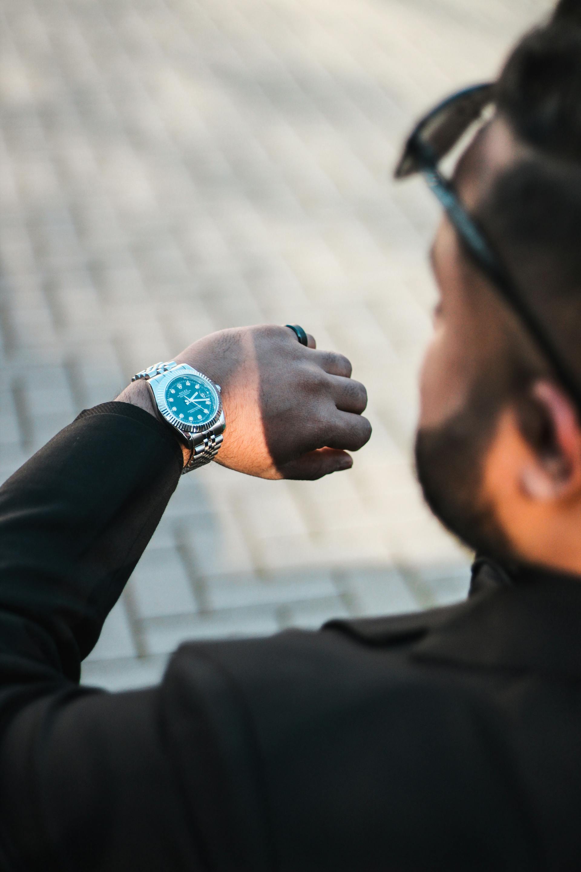 A man checking his watch | Source: Pexels