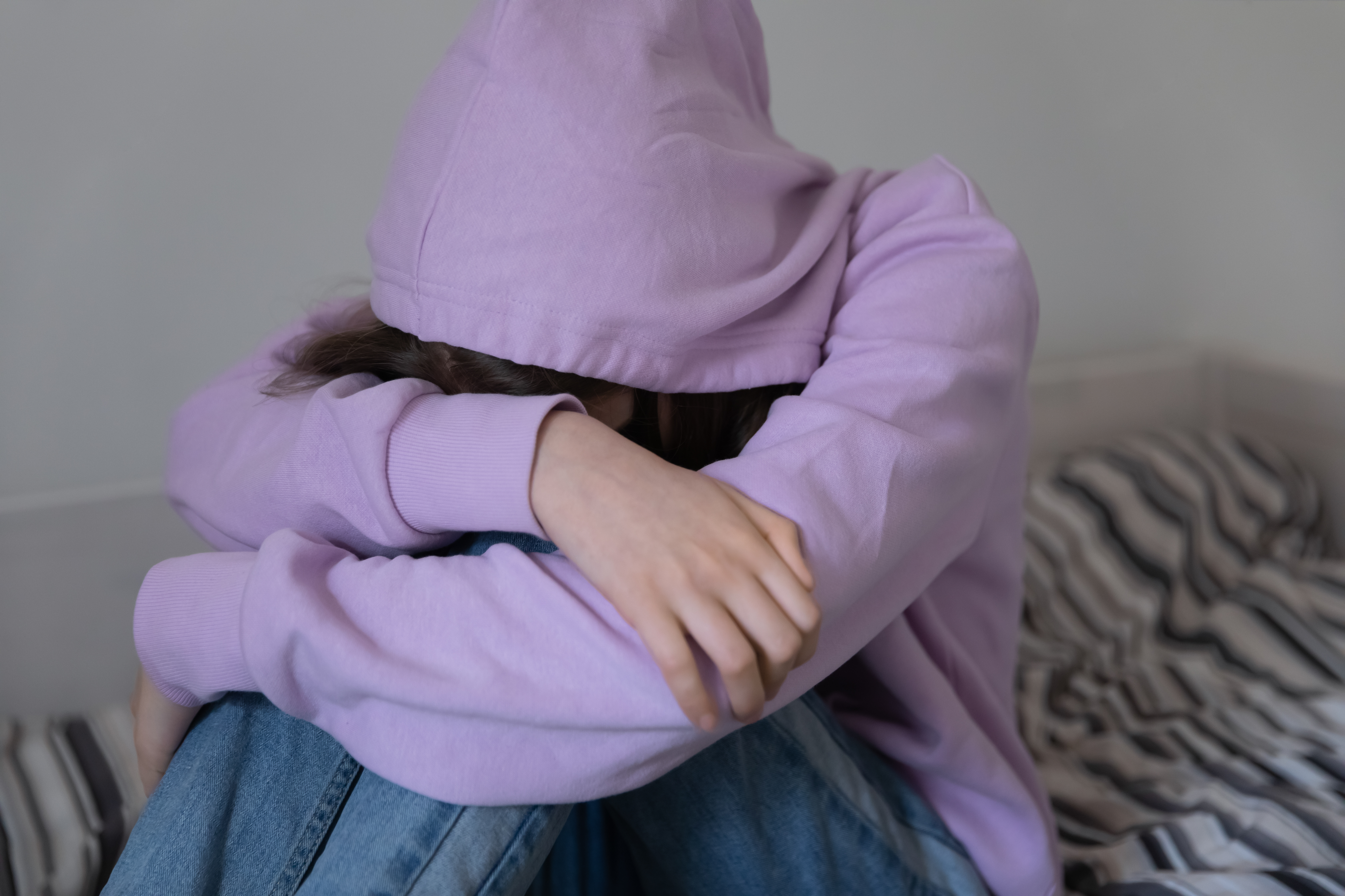 Unhappy young adolescent child girl | Source: Shutterstock