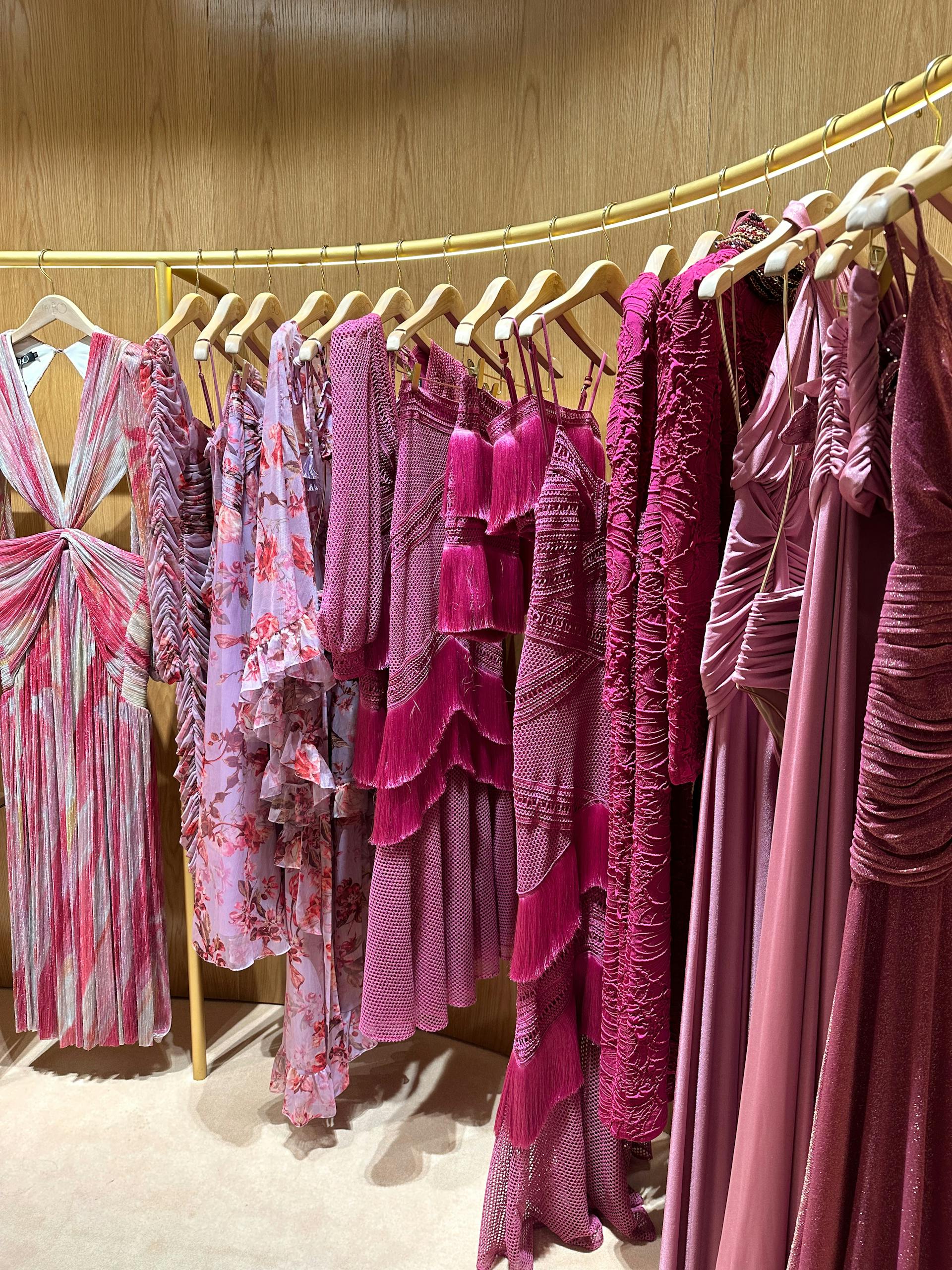 Dresses hanging in a store | Source: Pexels