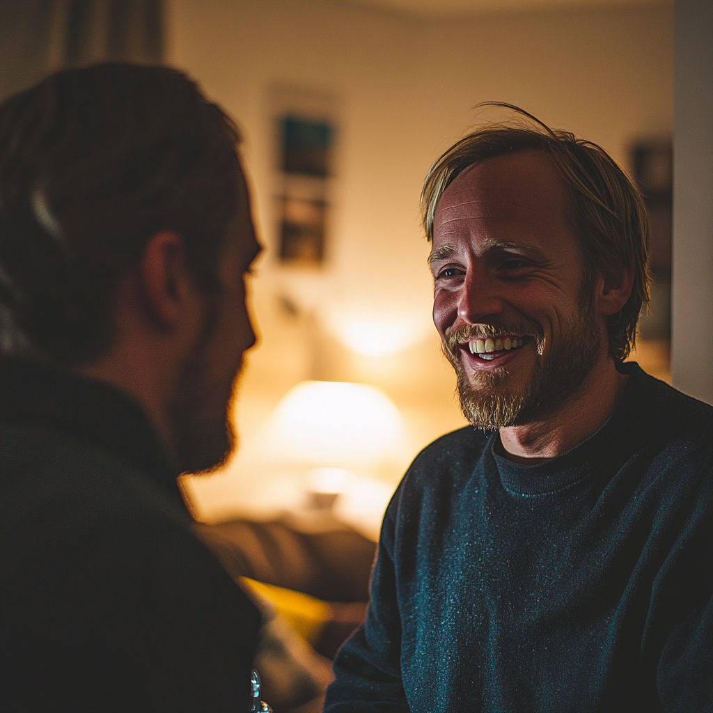 A smiling man talking to his friend | Source: Midjourney