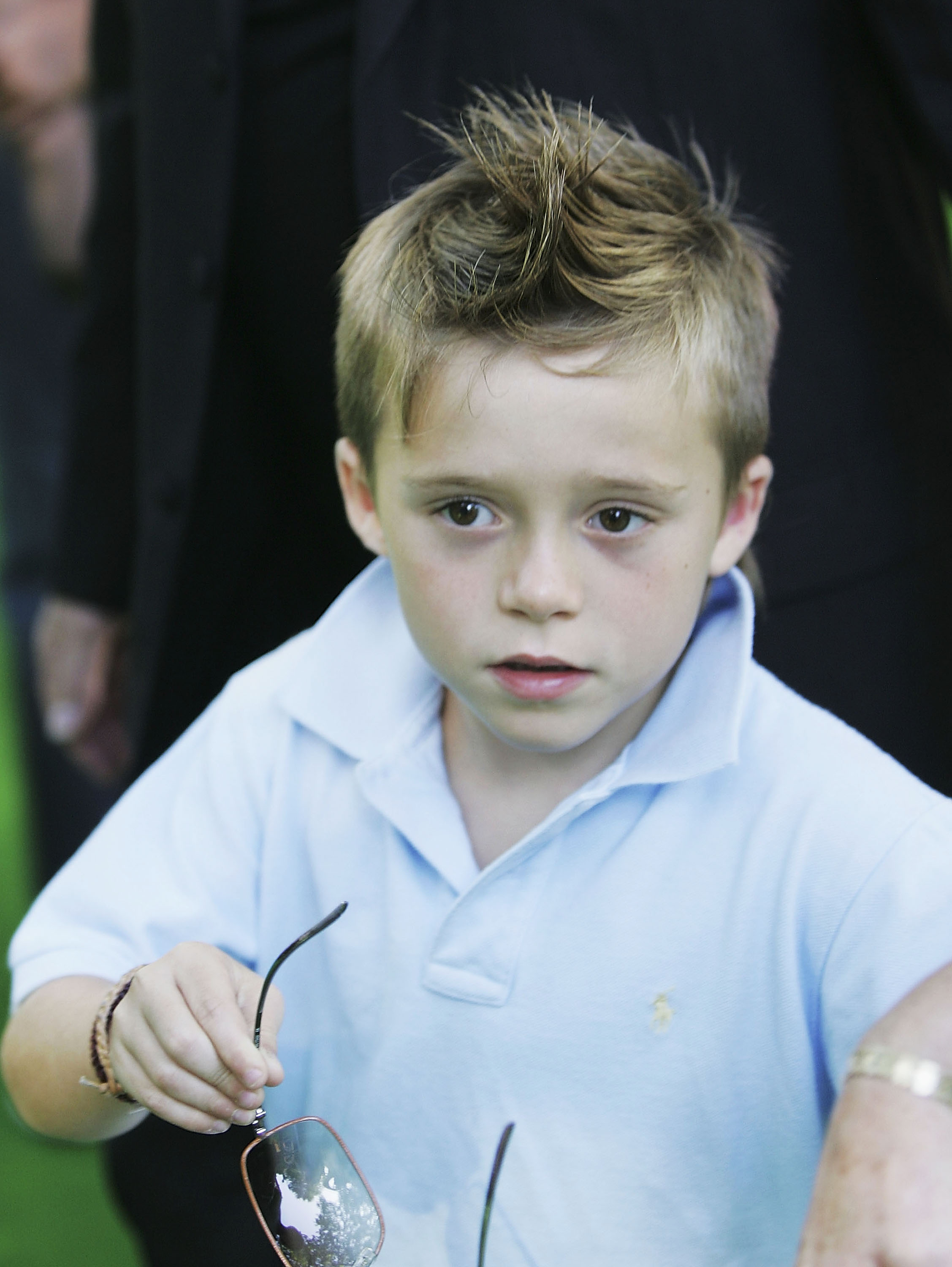 Brooklyn Beckham, son of footballer David and Victoria Beckham, arrives at the UK Premiere of "Charlie And The Chocolate Factory" at the Odeon Leicester Square on July 17, 2005 in London, England. | Source: Getty Images