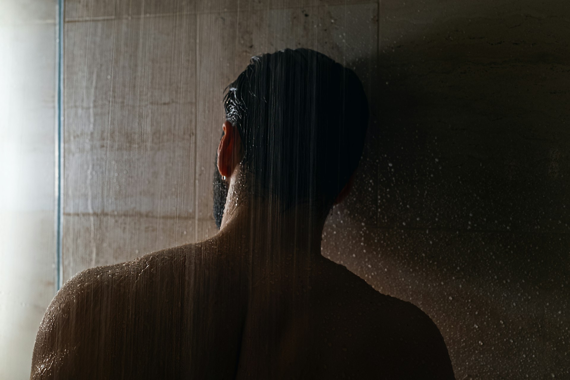 A man taking a shower | Source: Unsplash
