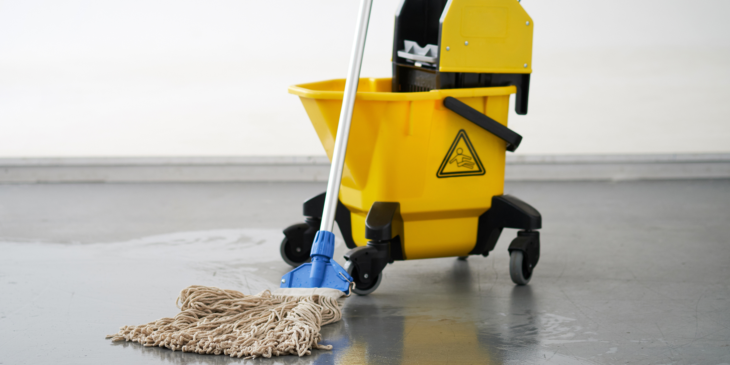 Mop and bucket on the floor | Source: Shutterstock