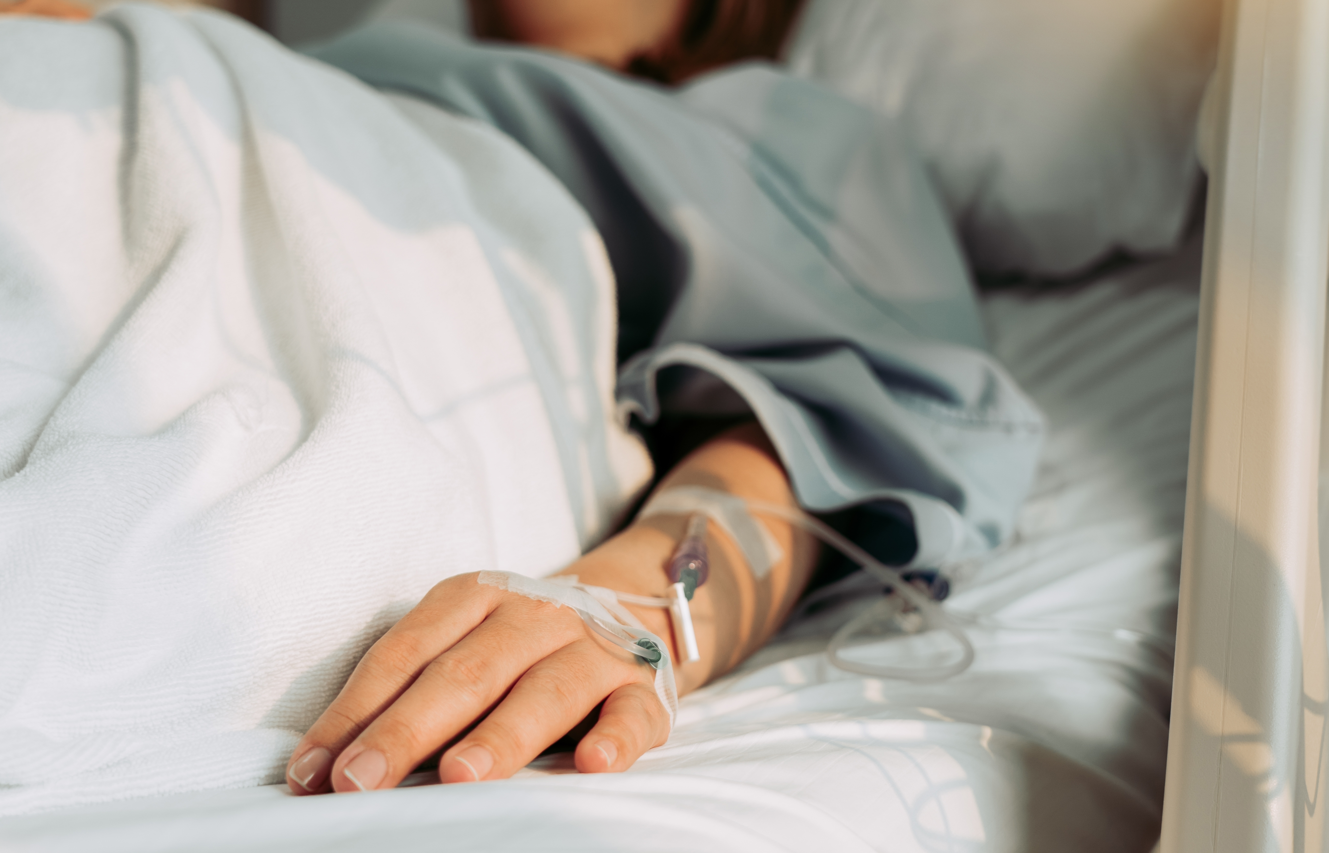 Woman lying sick in hospital | Source: Shutterstock