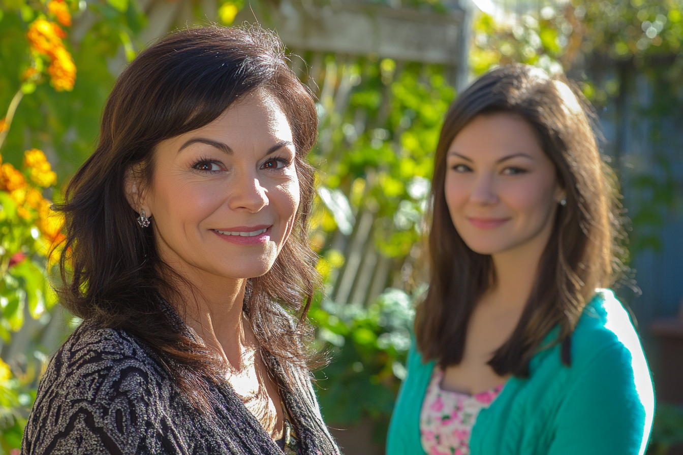 Two women standing in a back yard | Source: Midjourney