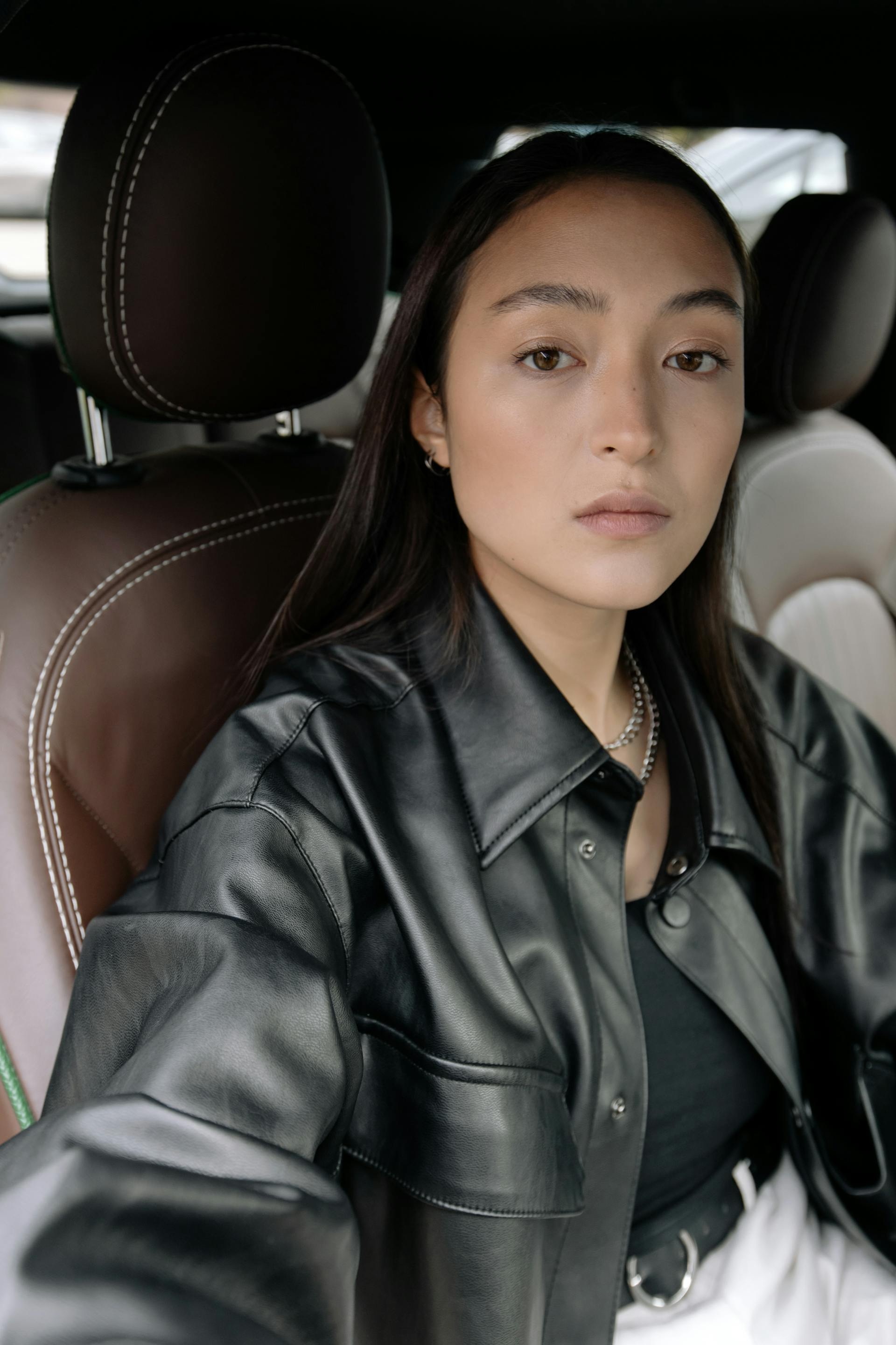 An upset woman in a car | Source: Pexels
