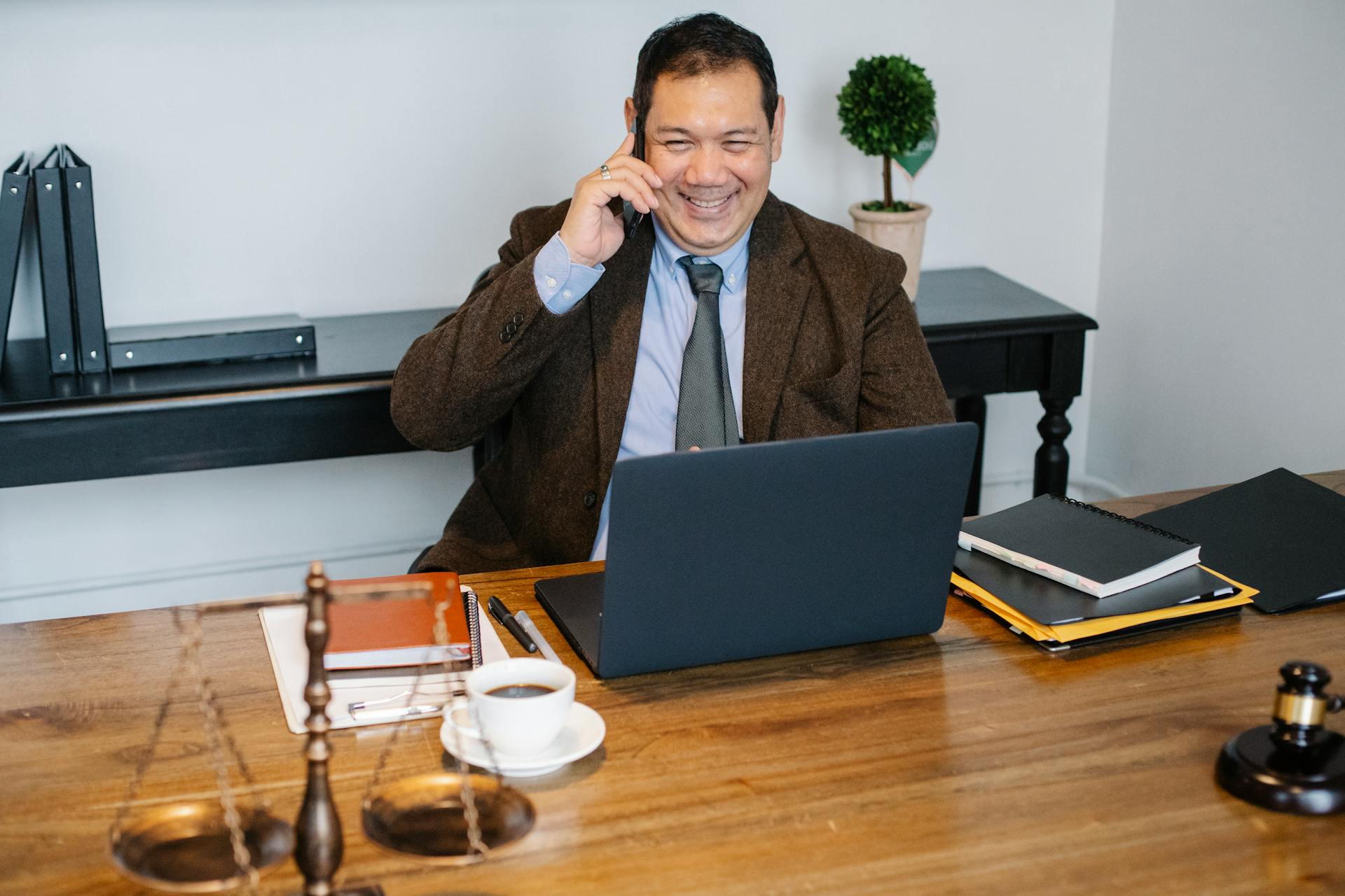 A lawyer talking on his phone | Source: Pexels