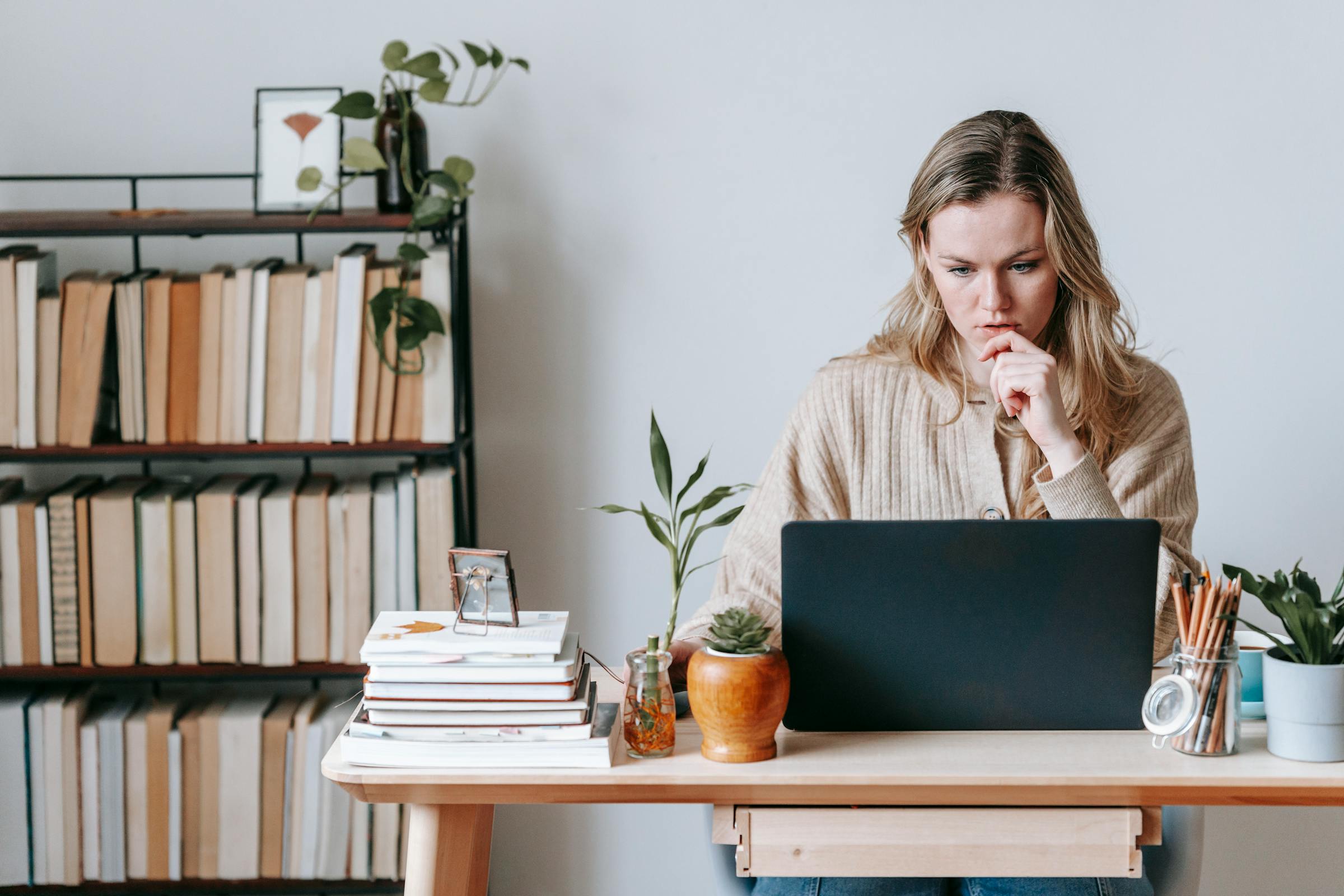 A serious woman looking at her computer | Source: Pexels