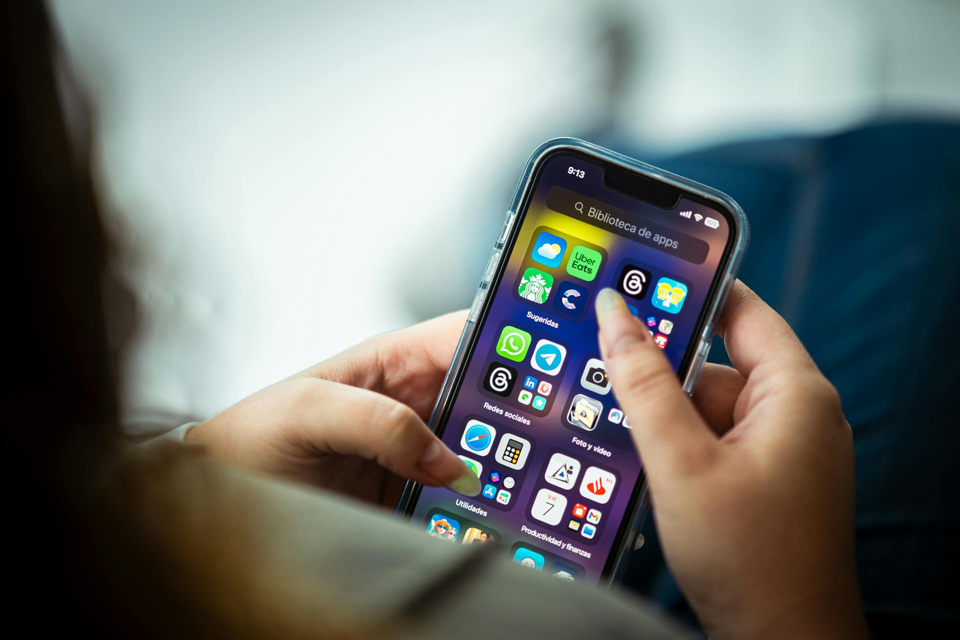 A woman holding her phone | Source: Pexels