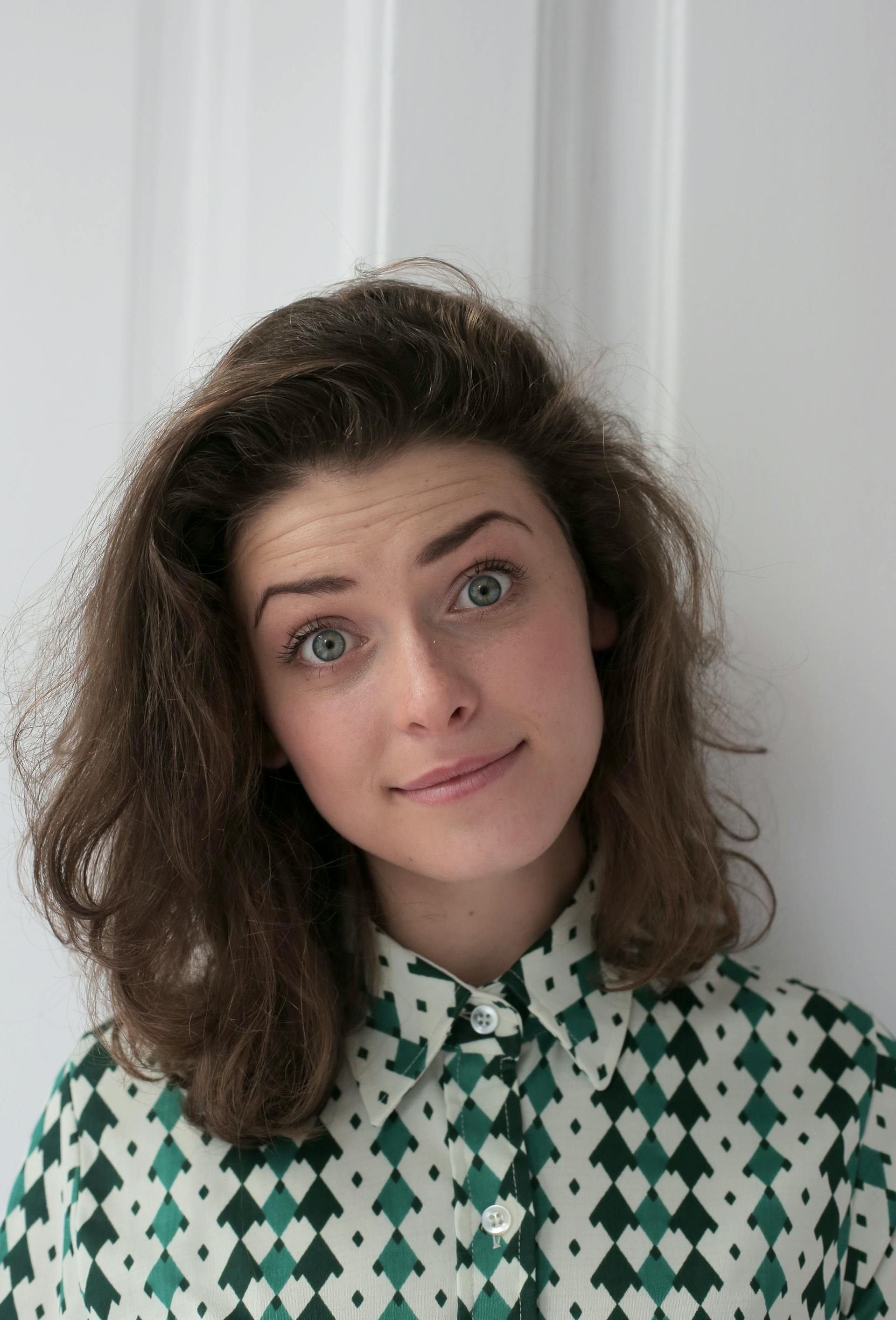A woman with wide open eyes looking at the camera | Source: Pexels