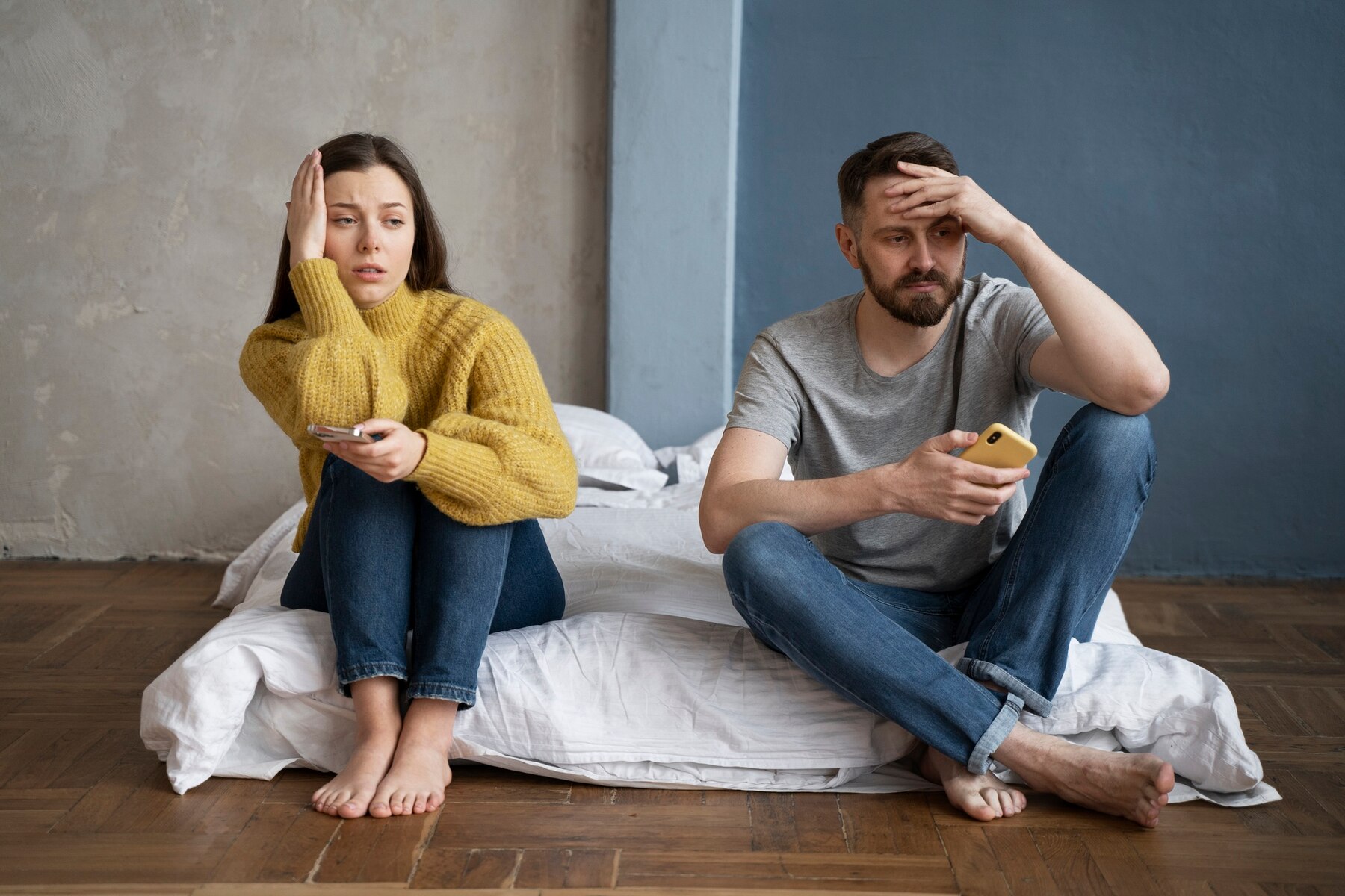 A sad couple in their empty bedroom | Source: Freepik