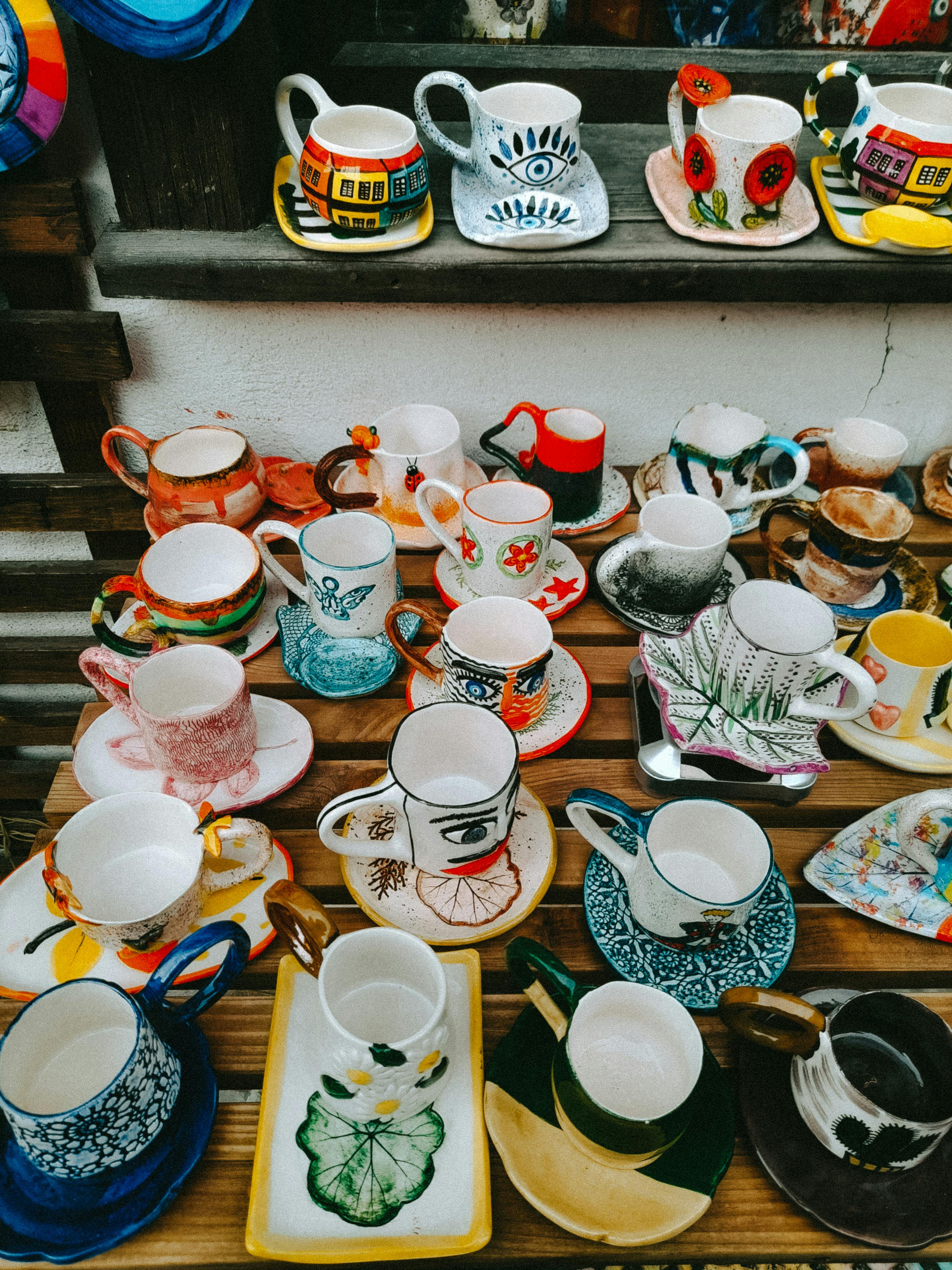 Multicolored mugs on display | Source: Pexels