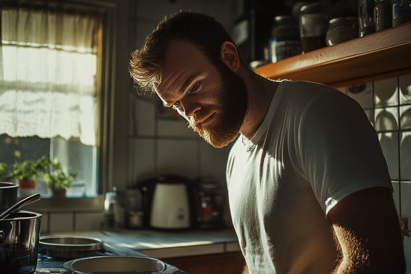 A man standing in the kitchen | Source: Midjourney
