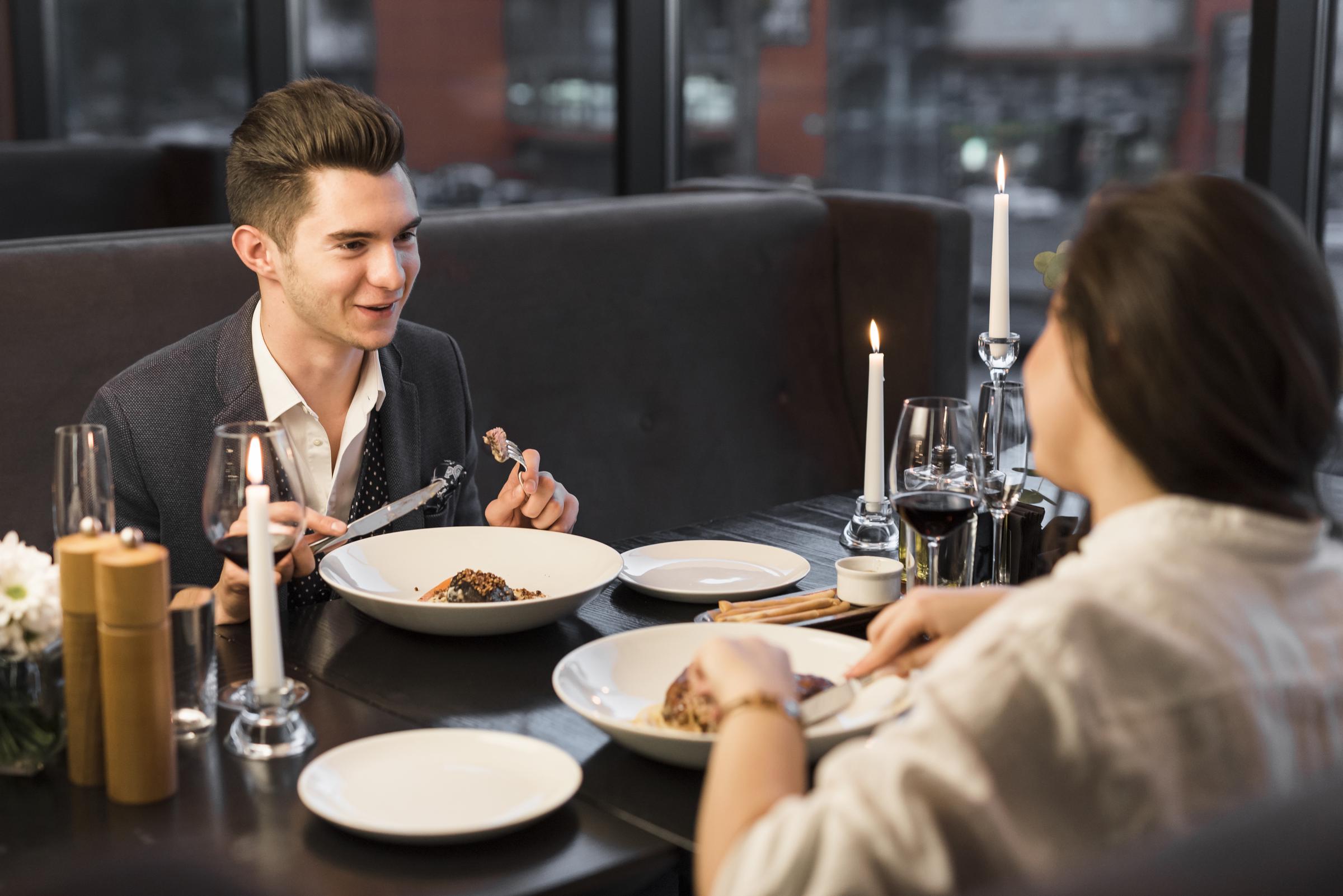 A couple talking in a restaurant | Source: Freepik