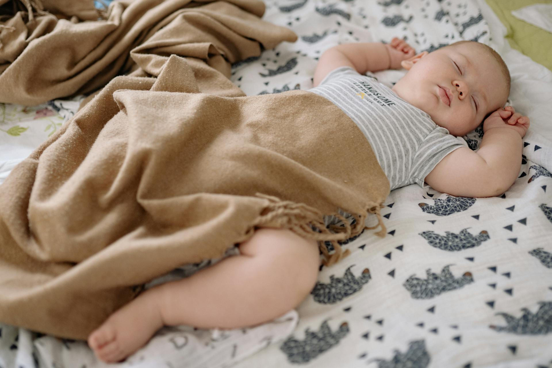 A baby sleeping in a crib | Source: Pexels