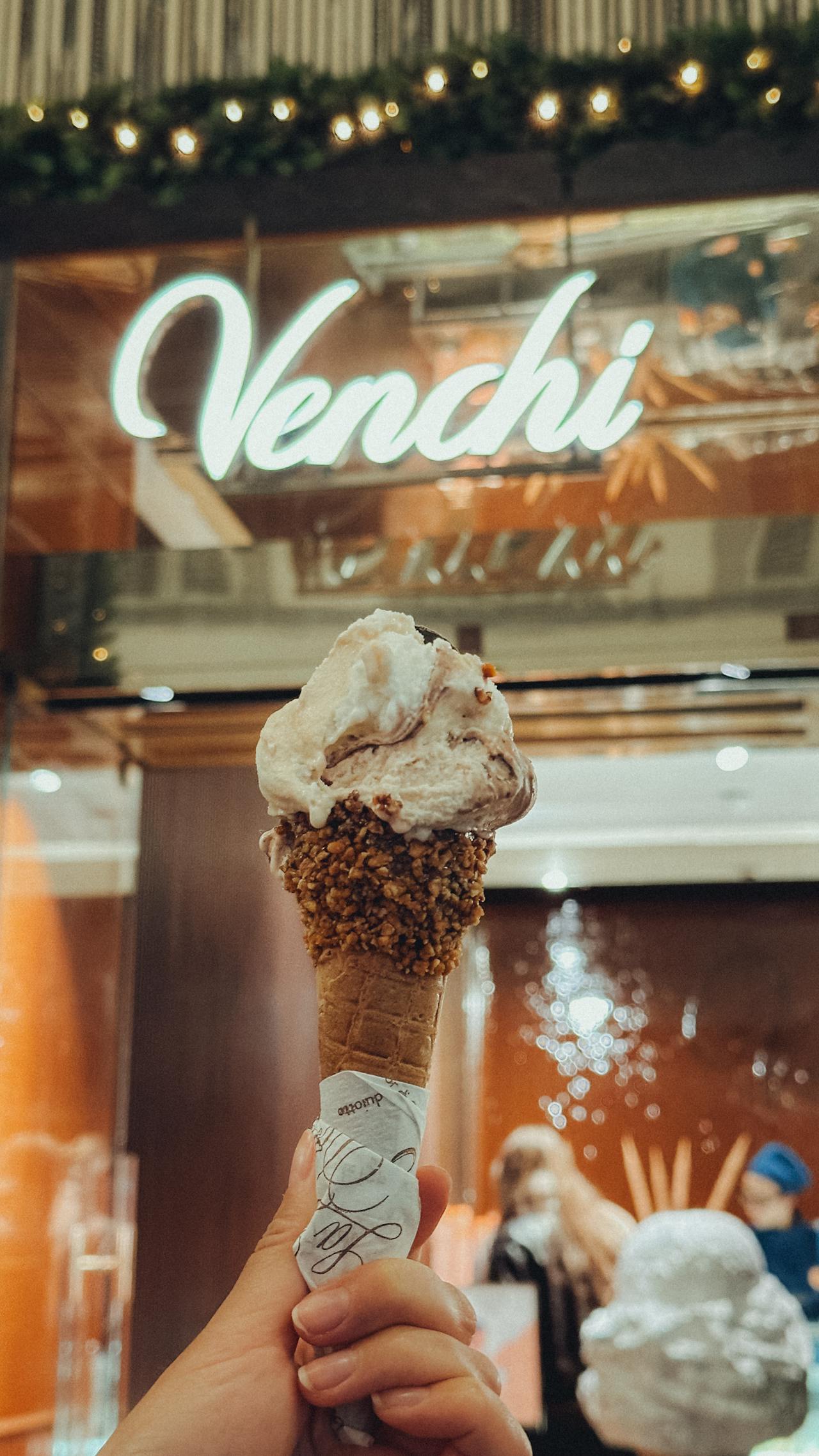 A young woman holding an ice cream cone | Source: Pexels