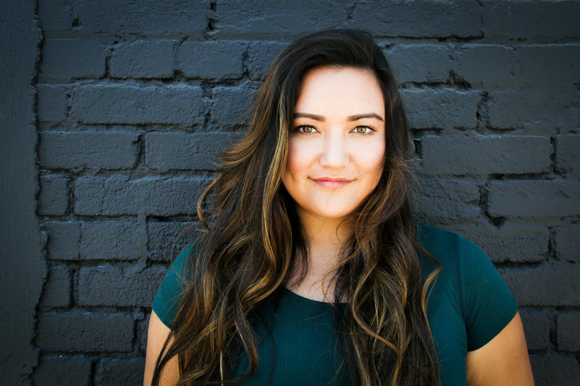 A woman smiling at someone | Source: Pexels