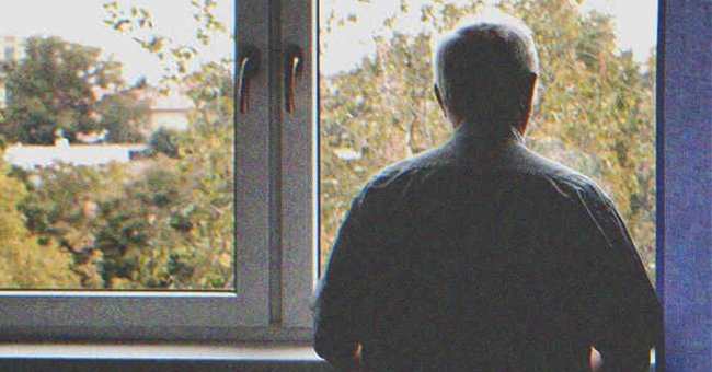 Old man looking out a window | Source: Shutterstock