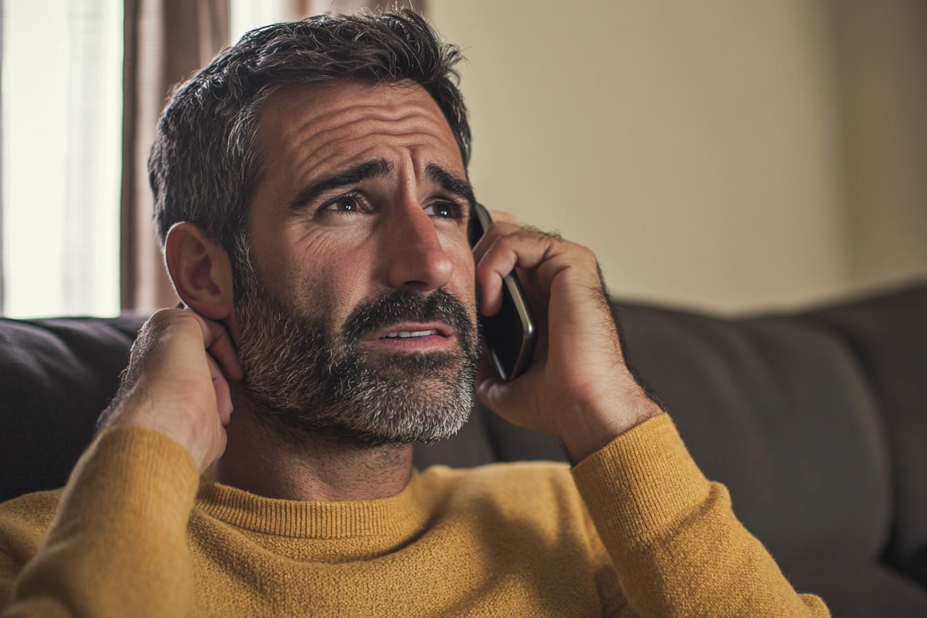 A man speaking on his phone | Source: Midjourney