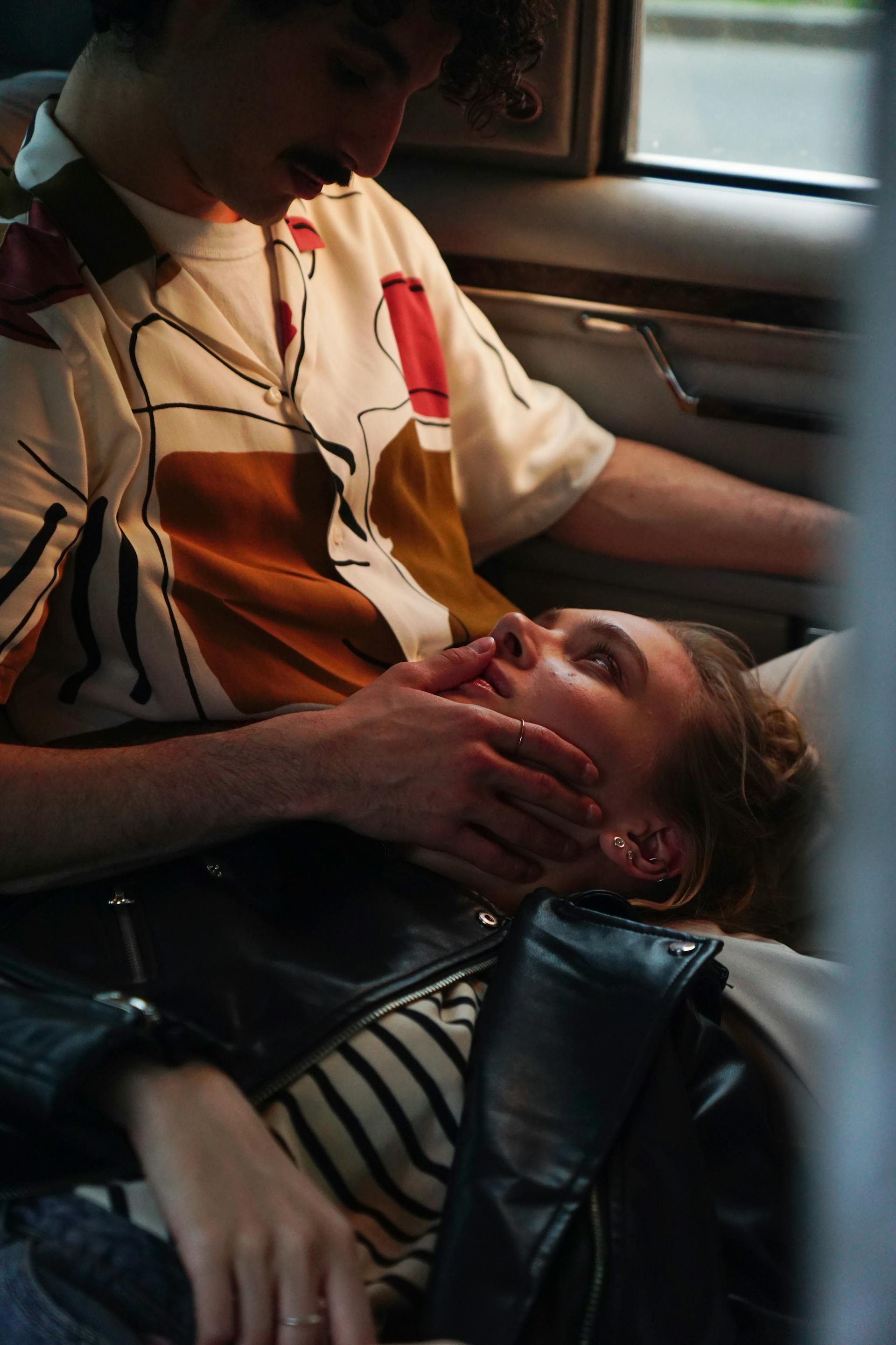A couple sitting in a car together | Source: Pexels