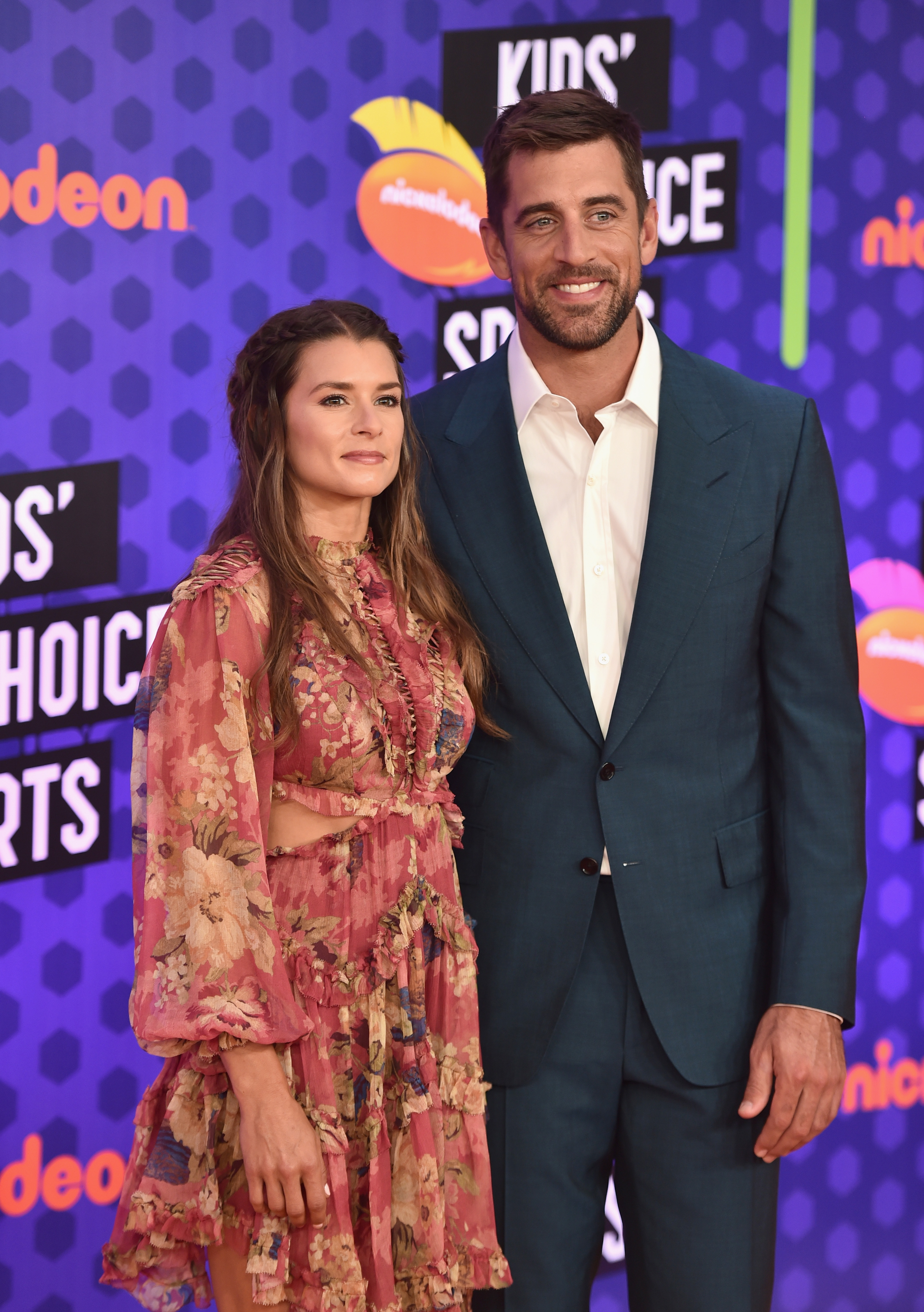 Danica Patrick (L) and NFL player Aaron Rodgers attend the Nickelodeon Kids' Choice Sports 2018 at Barker Hangar on July 19 in Santa Monica, California. | Source: Getty Images